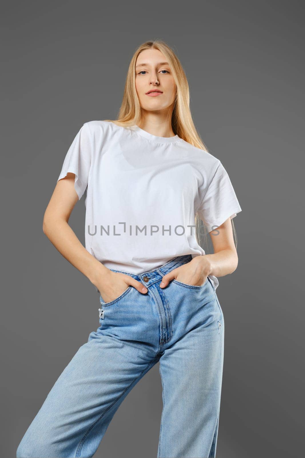 Bottom view of a tall, strict young woman looking arrogantly and haughtily