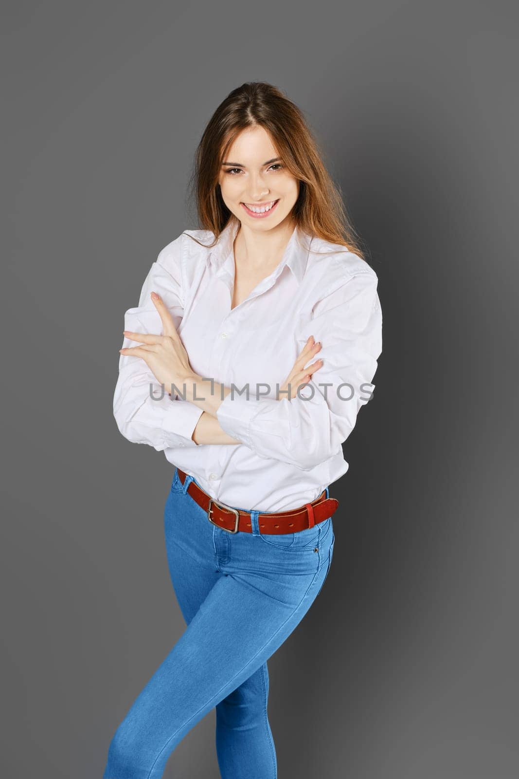 Top view of happy smiling woman with arms crossed on chest