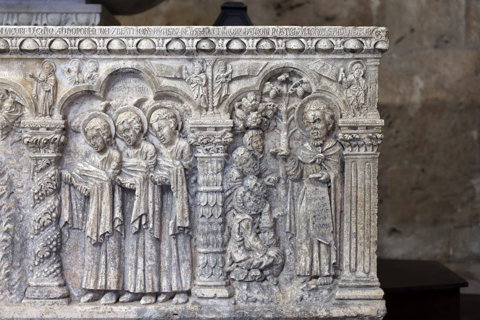 Massa Marittima, Italy - Sept 11, 2022:  Monumental baptismal font, with a rectangular bath surmounted by a small temple. The baptistery dates from 1267. Cathedral of Saint Cerbonius in Massa Marittima. Italy