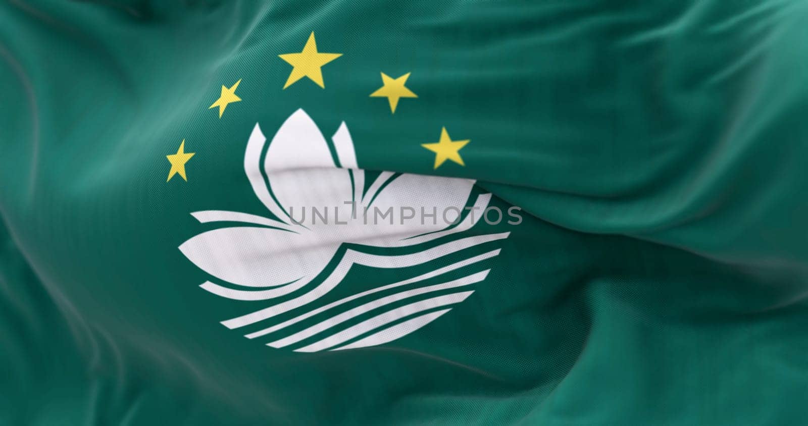 Close-up of Macau flag waving. Green area, lotus flower center, 5 stars atop, stylized bridge and waters below. 3d illustration render. Selective focus. Textured fabric background