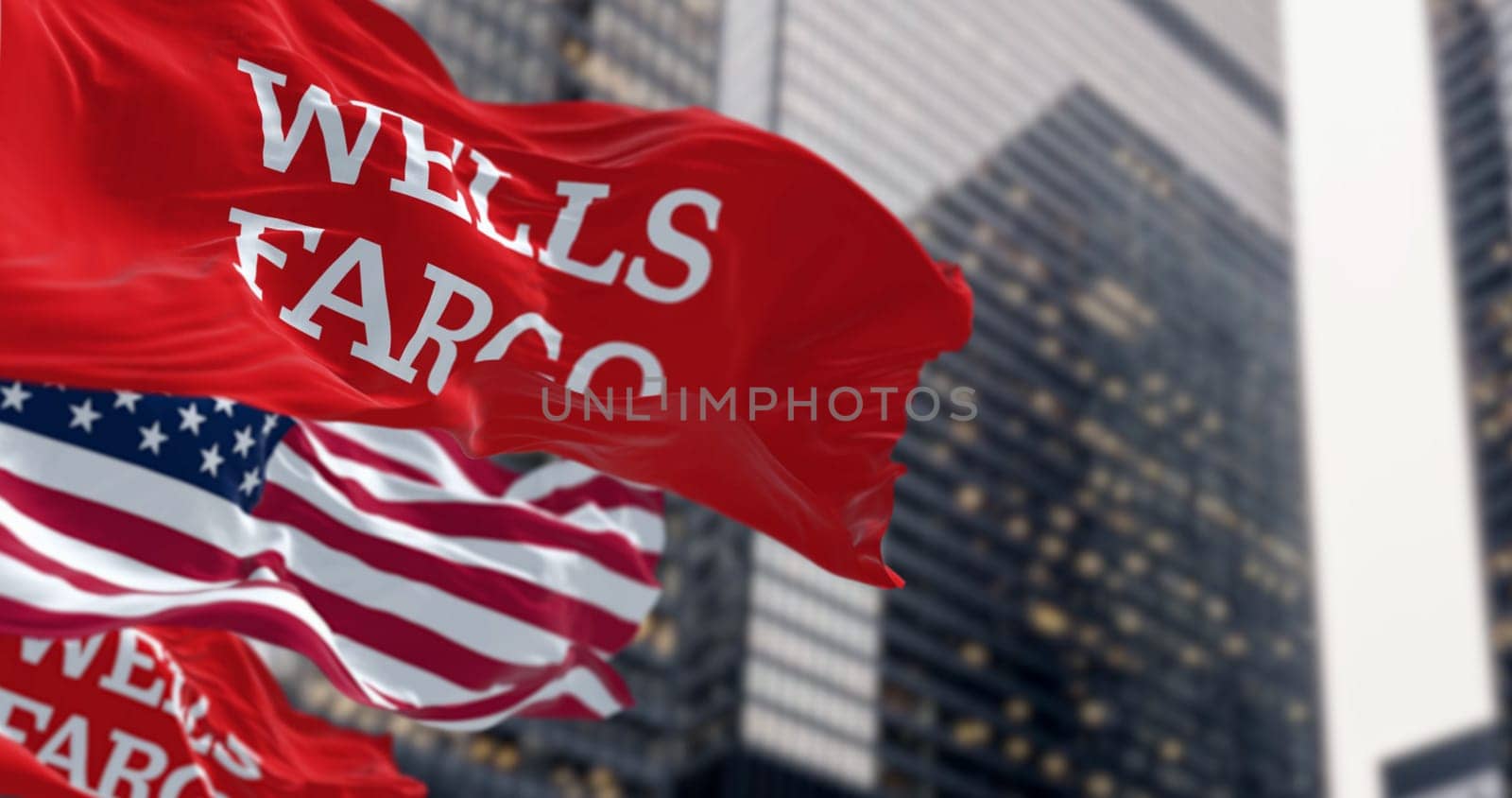 San Francisco, US, Oct. 1 2023: Wells Fargo bank and American flags waving in a financial district. Illustrative editorial 3d illustration. Finance and banking. Illustrative editorial 3d illustration