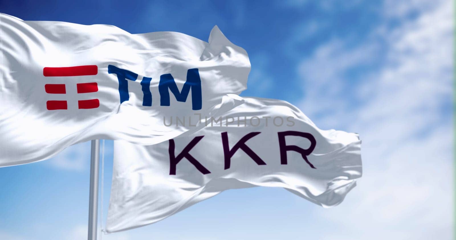Rome, IT, Nov. 5 2023: Flags of TIM and KKR waving on a clear day. KKR made a binding offer for TIM fixed network, including FiberCop. Illustrative editorial 3d illustration render