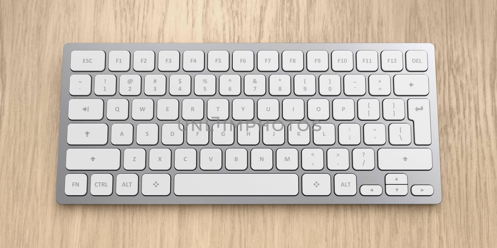 Modern wireless aluminum computer keyboard with white keys on wooden desk