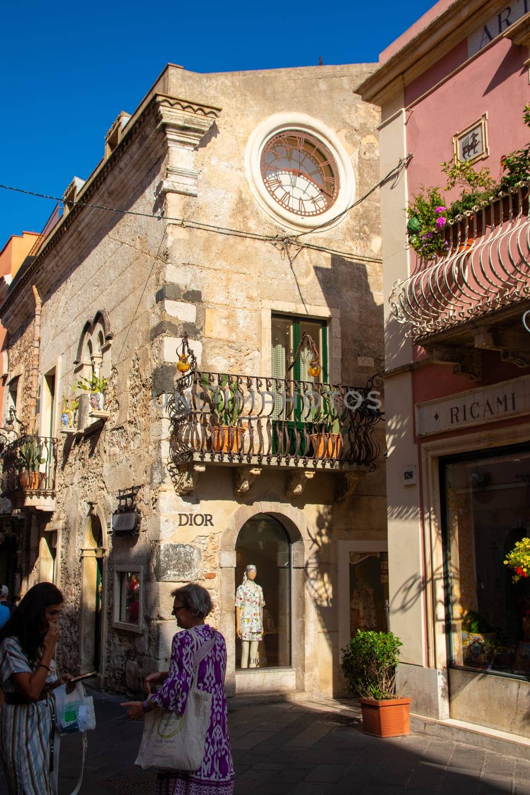 Taormina, Sicily, Italy - 28 September 2023. The main entrance of the luxury shop Dior on the famous Corso Umberto street in Taormina.