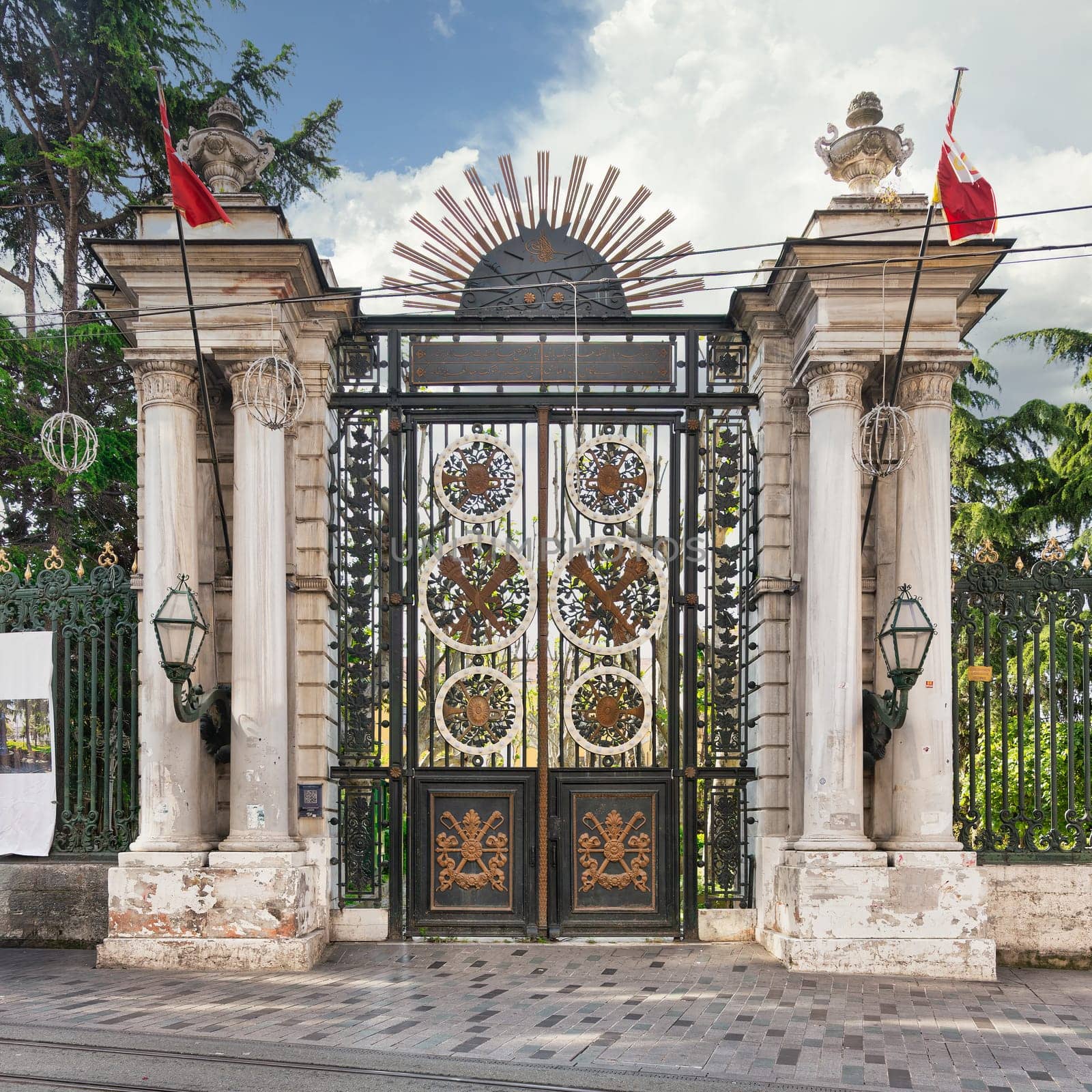 Istanbul, Turkey - May 13, 2023: Ornate 19th century wrought iron gate leading to Galatasaray High School, located on Istiklal Street, Beyoglu, designed by the French architect Alexandre Vallaury