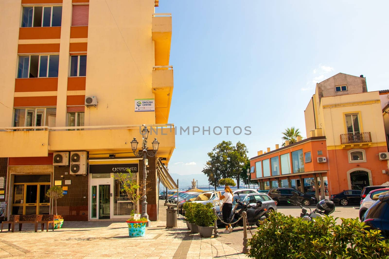 MILAZZO, SIZILY, Italy - 03 October 2023. The street Piano Baele with the English Zenrum and in the background the ''Fountain of the Amphorae'' or fountain of Stephen Descartes in Milazzo.