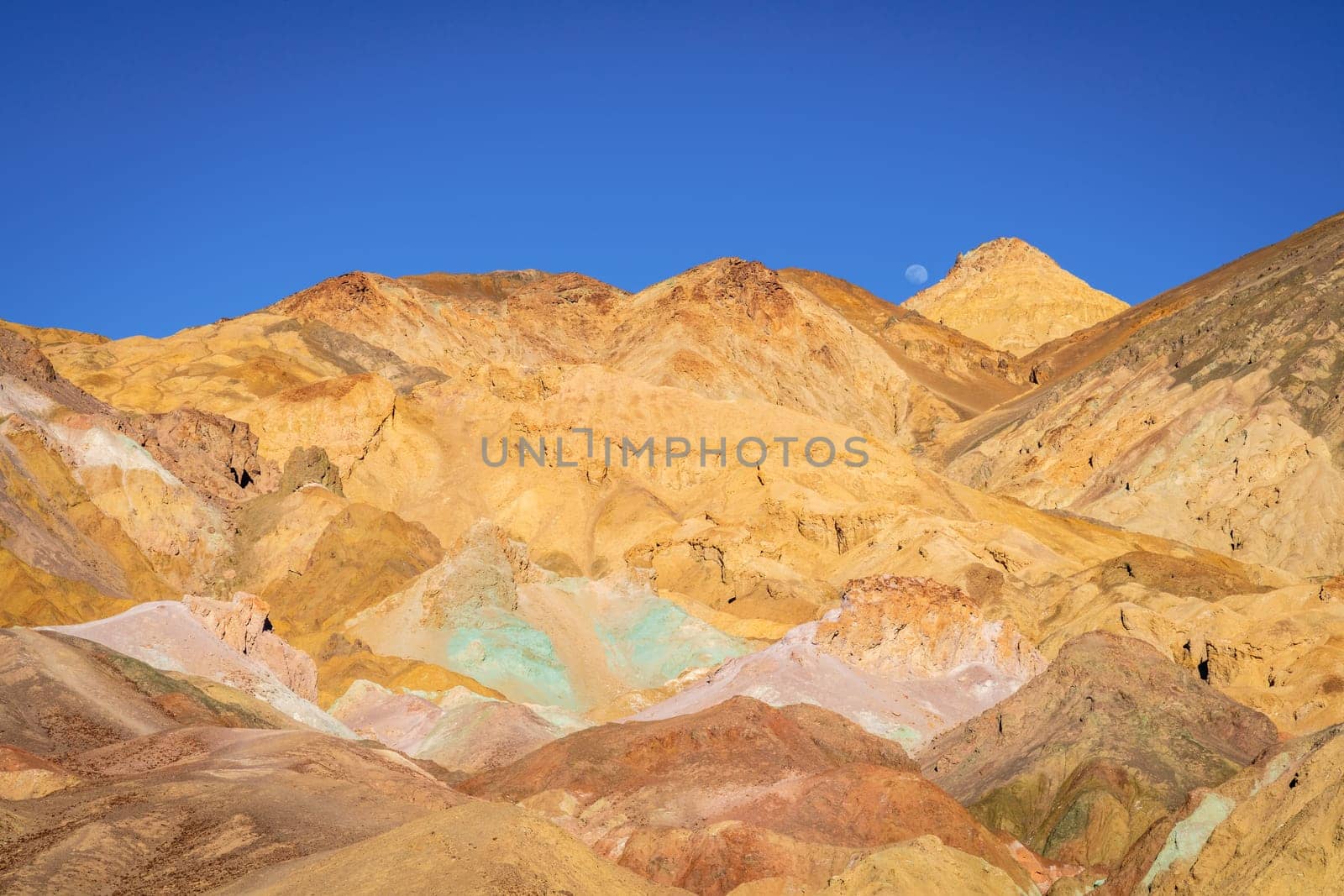 Scenic view of Artist Palette - hills covered in colorful volcanic deposits in Death Valley National Park, California