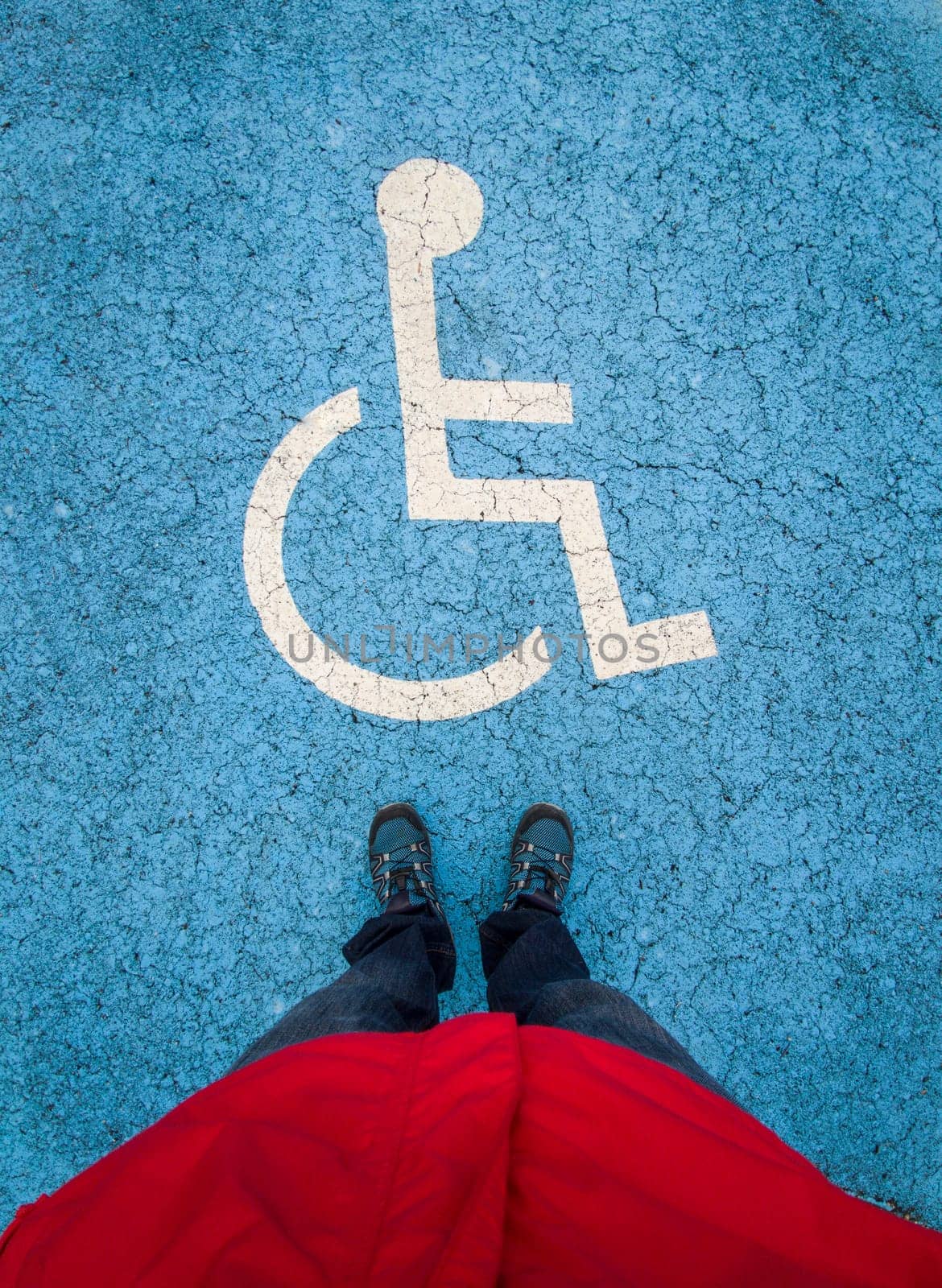 Reserved parking for vehicles of people with disabilities. First person point of view