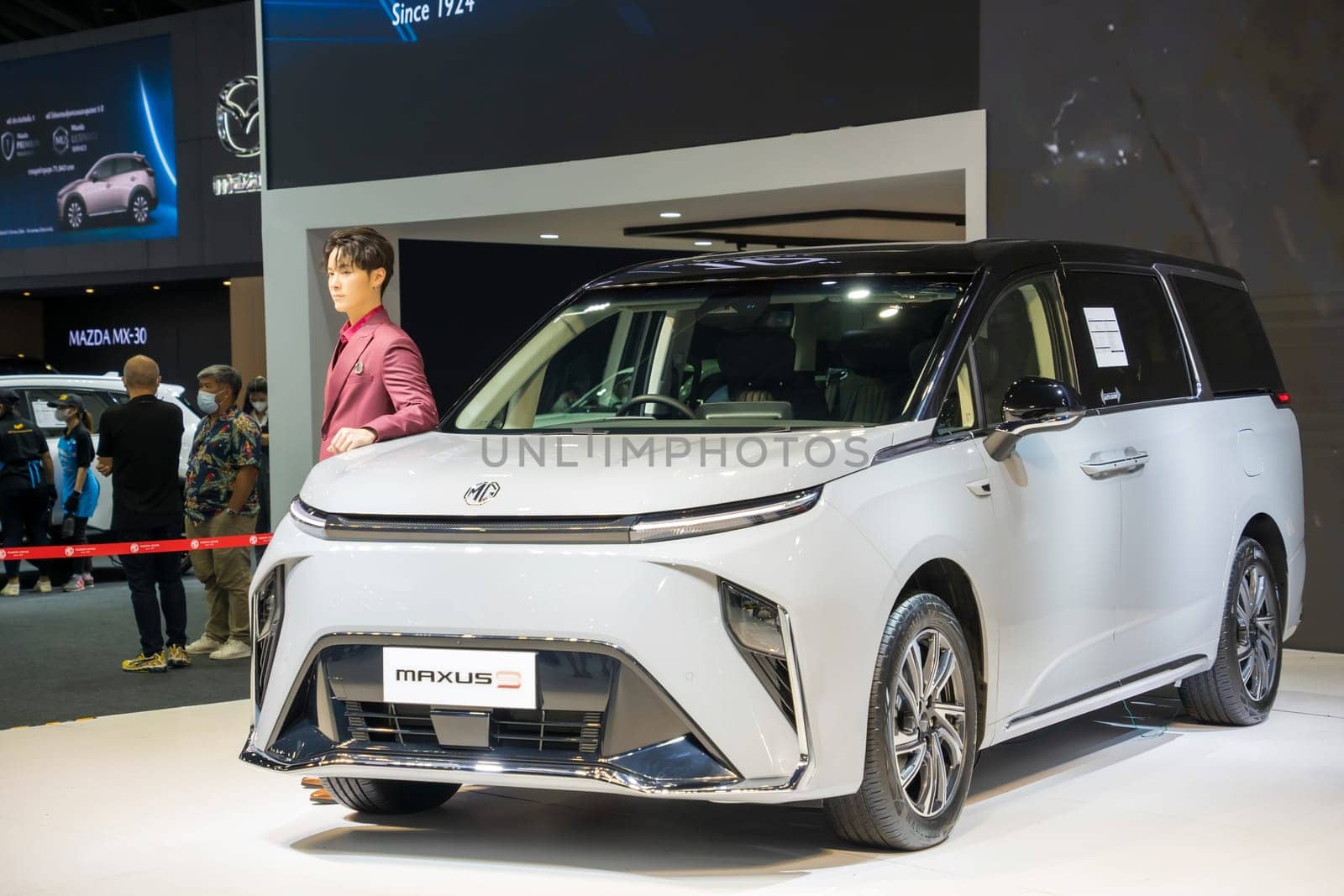 Nonthaburi, Thailand - APR 2, 2023 Unidentified model poses with a car at The 44th Bangkok international motor show 2023 at IMPACT Arena, Muang Thong Thani, Nonthaburi, Thailand.