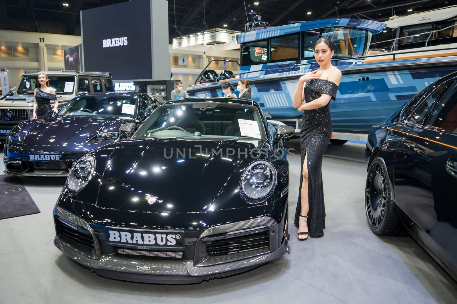 Nonthaburi, Thailand - APR 2, 2023 Unidentified model poses with a car at The 44th Bangkok international motor show 2023 at IMPACT Arena, Muang Thong Thani, Nonthaburi, Thailand.