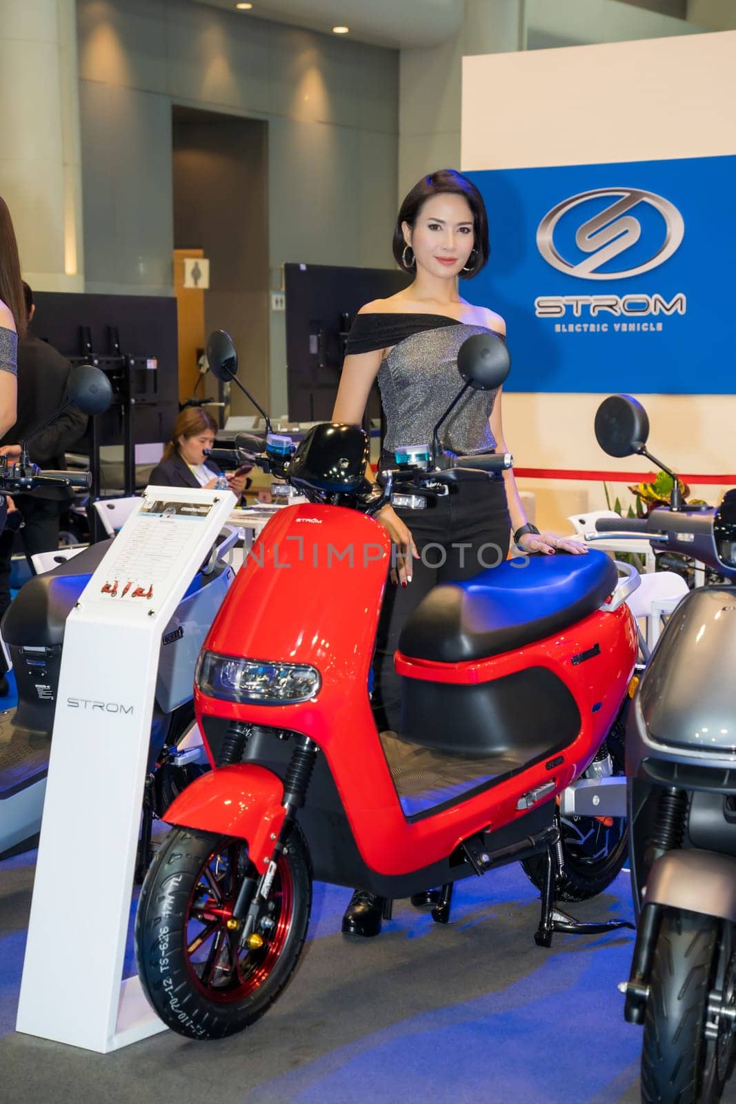 Nonthaburi, Thailand - APR 2, 2023 Unidentified model poses with a car at The 44th Bangkok international motor show 2023 at IMPACT Arena, Muang Thong Thani, Nonthaburi, Thailand.