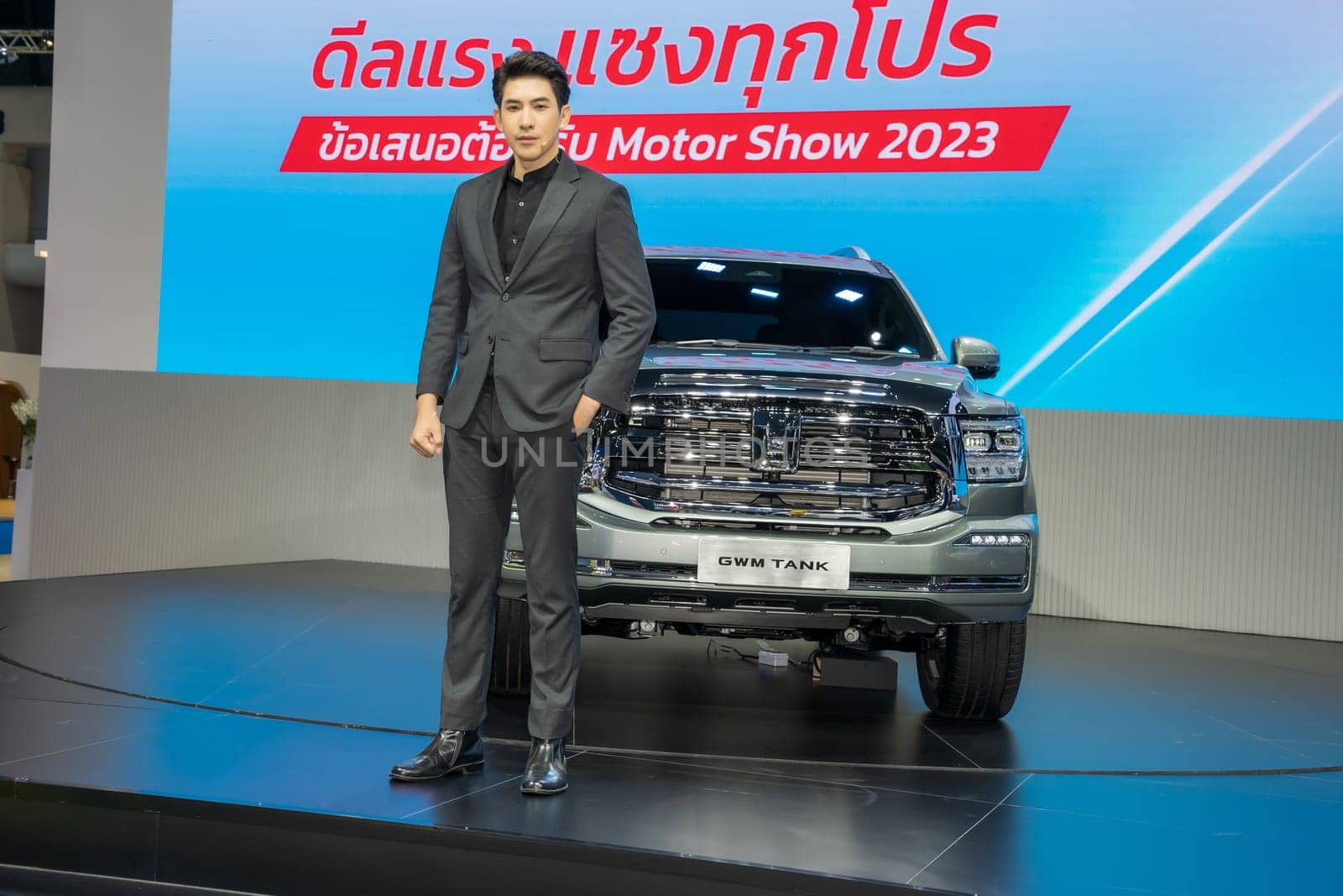 Nonthaburi, Thailand - APR 2, 2023 Unidentified model poses with a car at The 44th Bangkok international motor show 2023 at IMPACT Arena, Muang Thong Thani, Nonthaburi, Thailand.