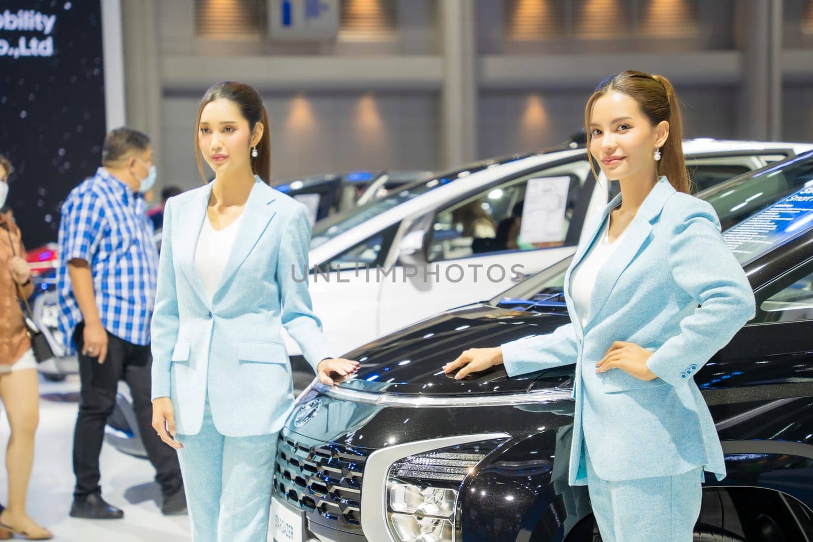 Nonthaburi, Thailand - APR 2, 2023 Unidentified model poses with a car at The 44th Bangkok international motor show 2023 at IMPACT Arena, Muang Thong Thani, Nonthaburi, Thailand.