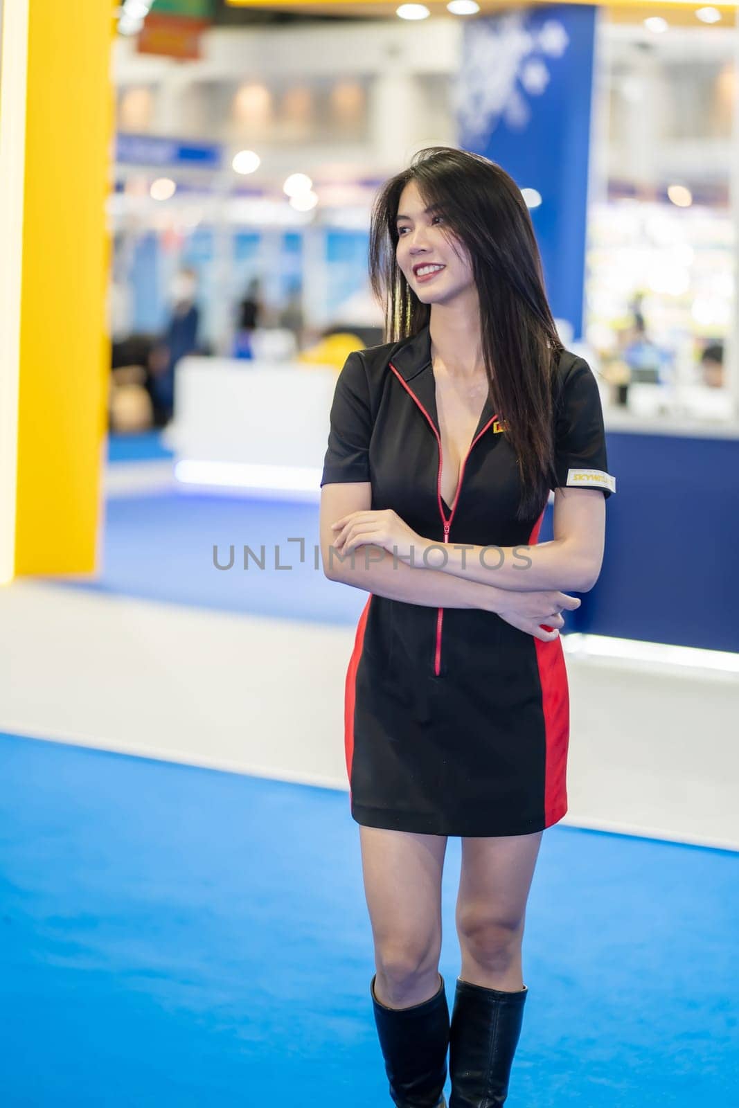 Nonthaburi, Thailand - MAR 26, 2023 Unidentified model poses with a car at The 44th Bangkok international motor show 2023 at IMPACT Arena, Muang Thong Thani, Nonthaburi, Thailand.