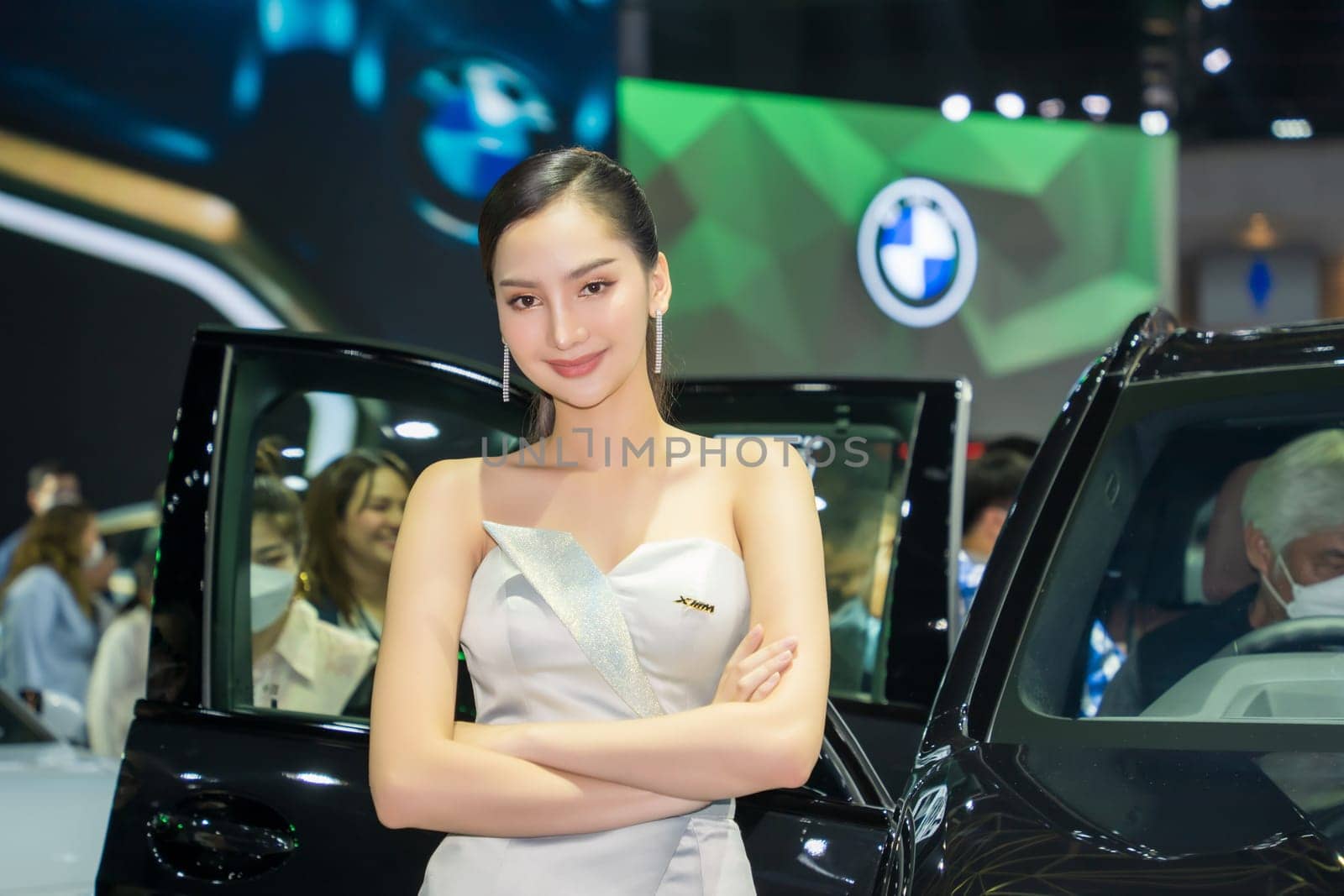 Nonthaburi, Thailand - APR 2, 2023 Unidentified model poses with a car at The 44th Bangkok international motor show 2023 at IMPACT Arena, Muang Thong Thani, Nonthaburi, Thailand.