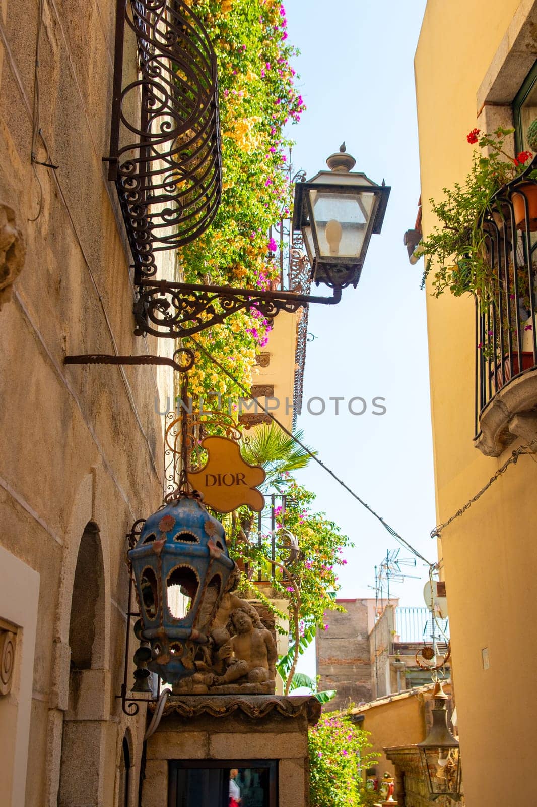 Taormina, Sicily, Italy - 28 September 2023. A side entrance of Dior in Vico Ascanio Marziani on the corner of Corso Umberto street.