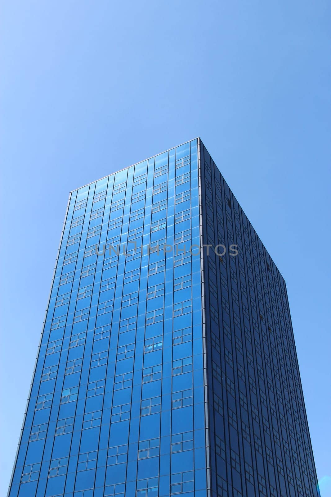 Modern beautiful skyscraper. Modern construction. Urban architecture. Buildings of big cities. Beautiful modern architecture of the building
