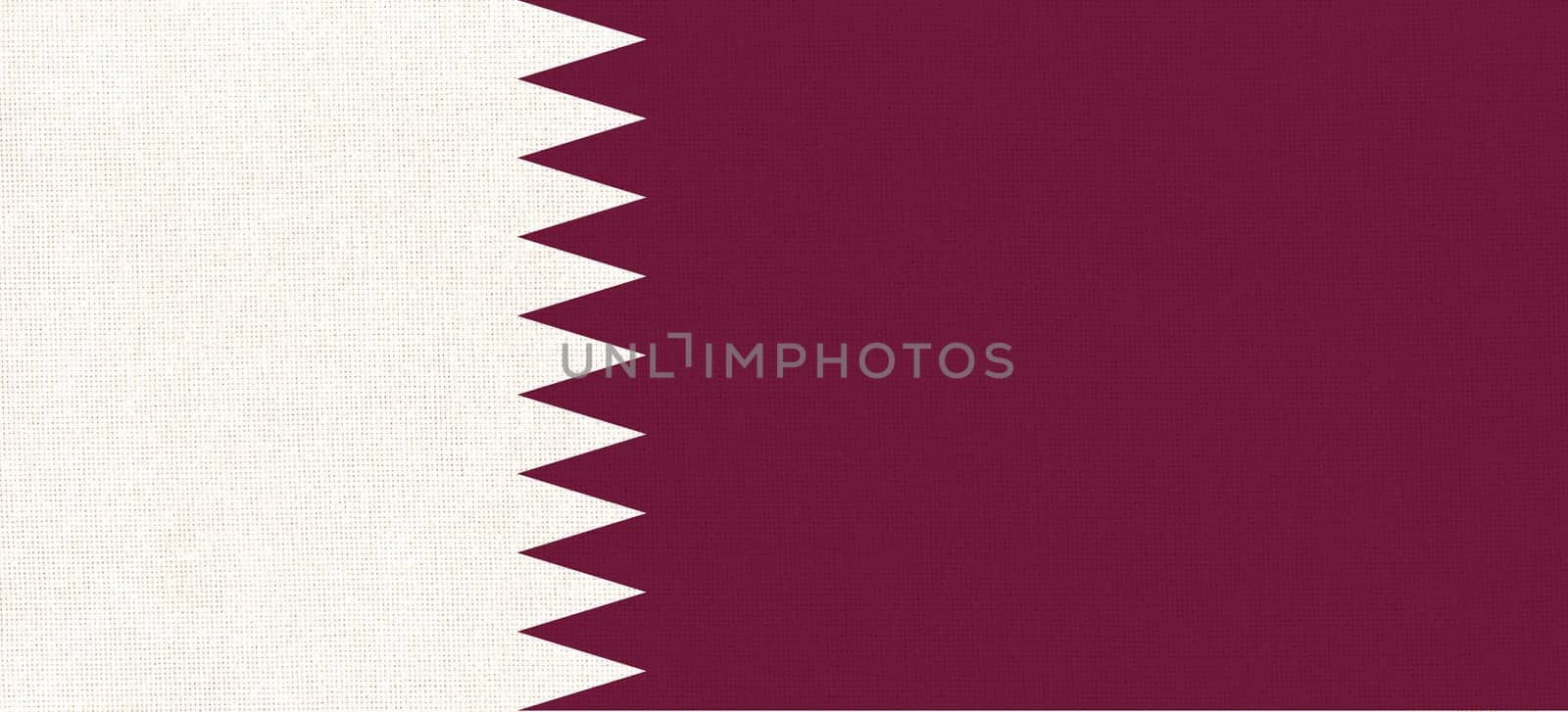 Flag of Qatar on fabric surface. Qatar national flag on texture. Fabric Texture. Asian country. Doha capital. State symbol