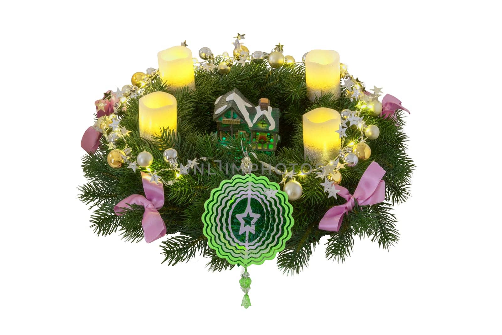 Christmas wreaths. Close-up of a beautiful colourful christmas wreath with candles and decoration elements and various lights isolated on a white background.