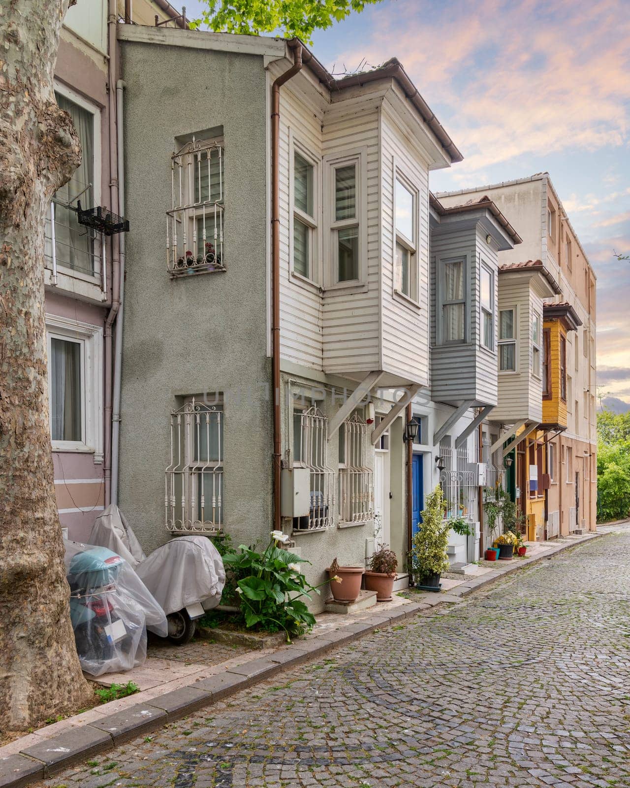 Cobblestone alley with traditional colorful wooden houses, suited in Kuzguncuk neighborhood, Uskudar district, Istanbul, Turkey