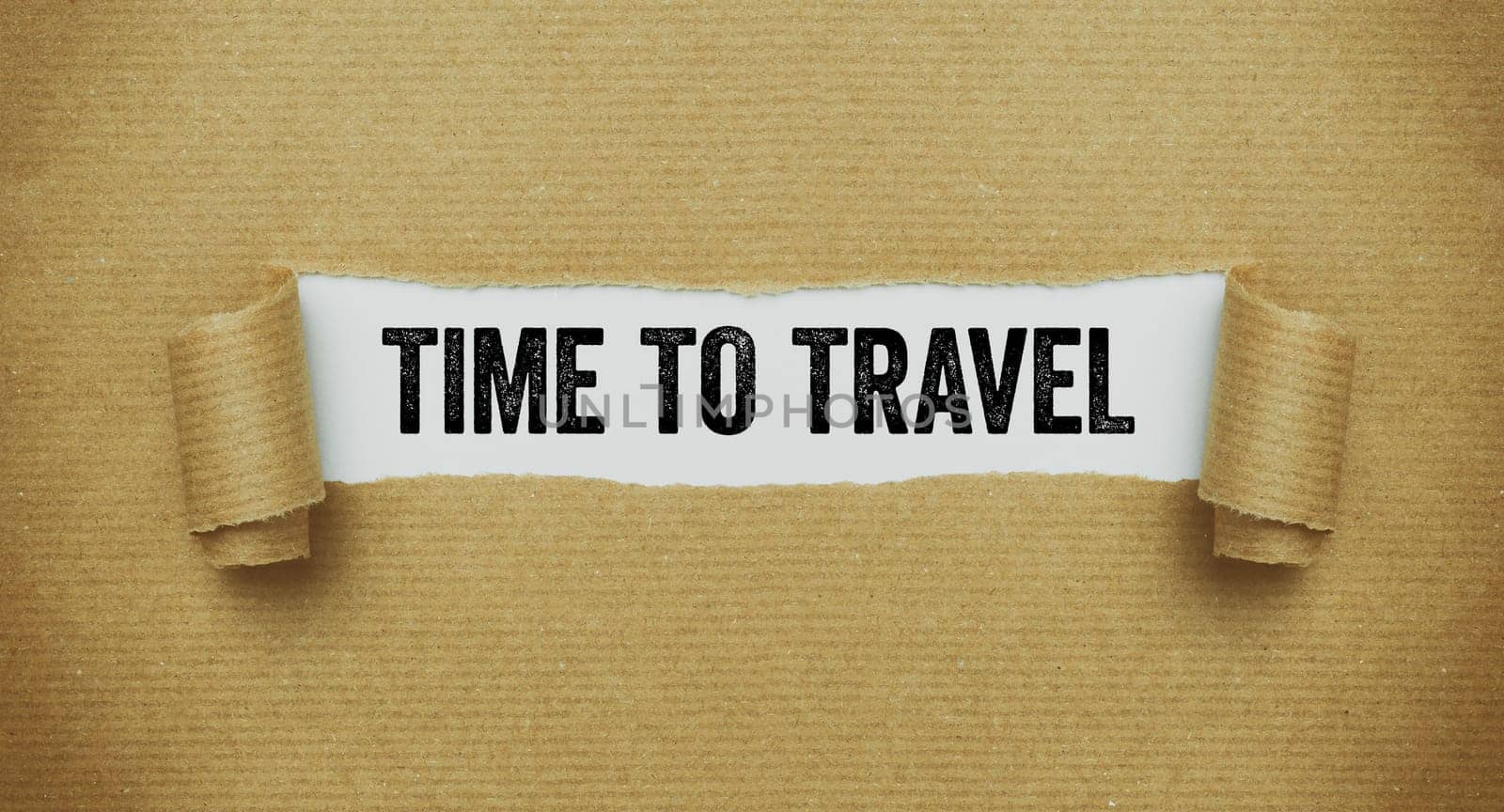 Torn paper revealing the words Time to travel