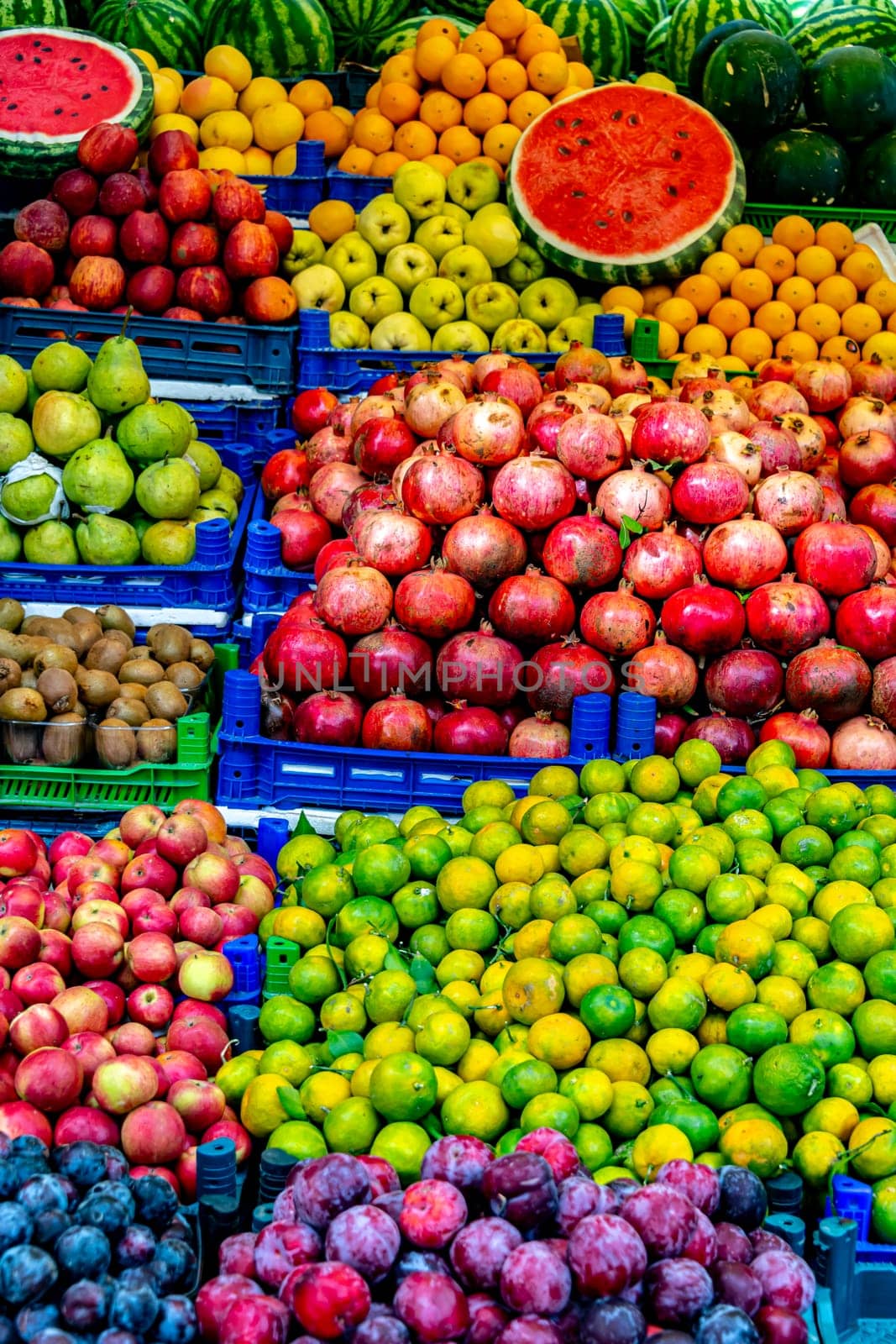 Variety of fresh fruits put out on sale on the street stall.