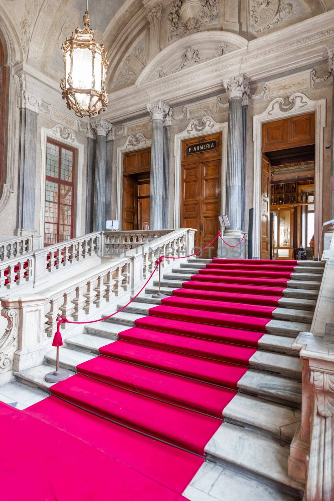 Turin, Italy - Circa January 2022: red carpet in Royal Palace - luxury elegant marble stairway