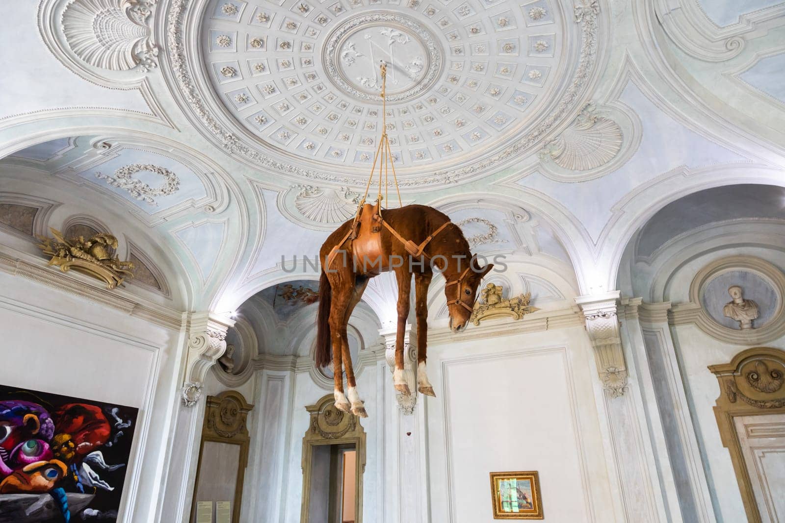 Rivoli, Italy - June 2022: Maurizio Cattelan provocative contemporary art - Novecento