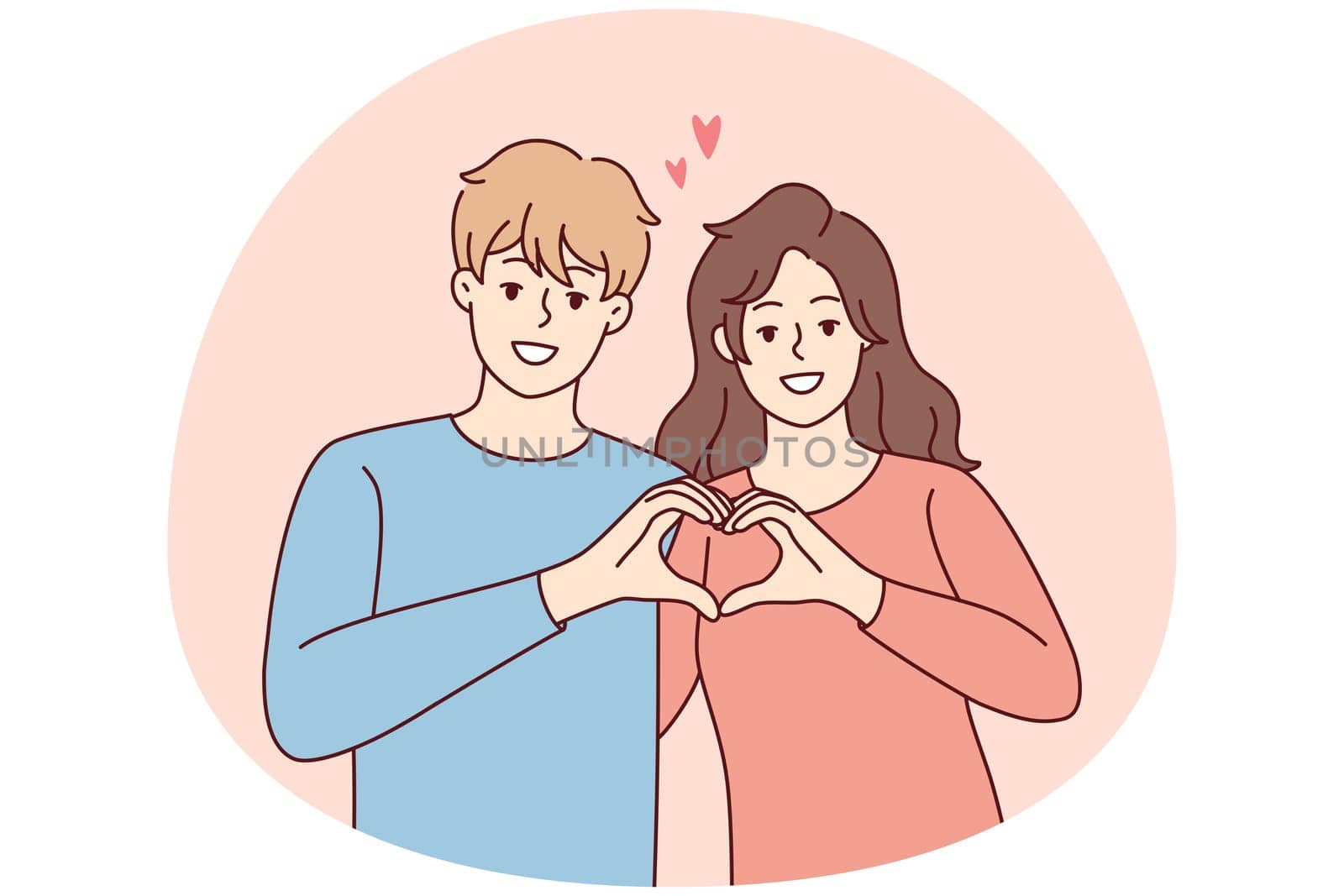 Smiling couple show heart hand gesture
