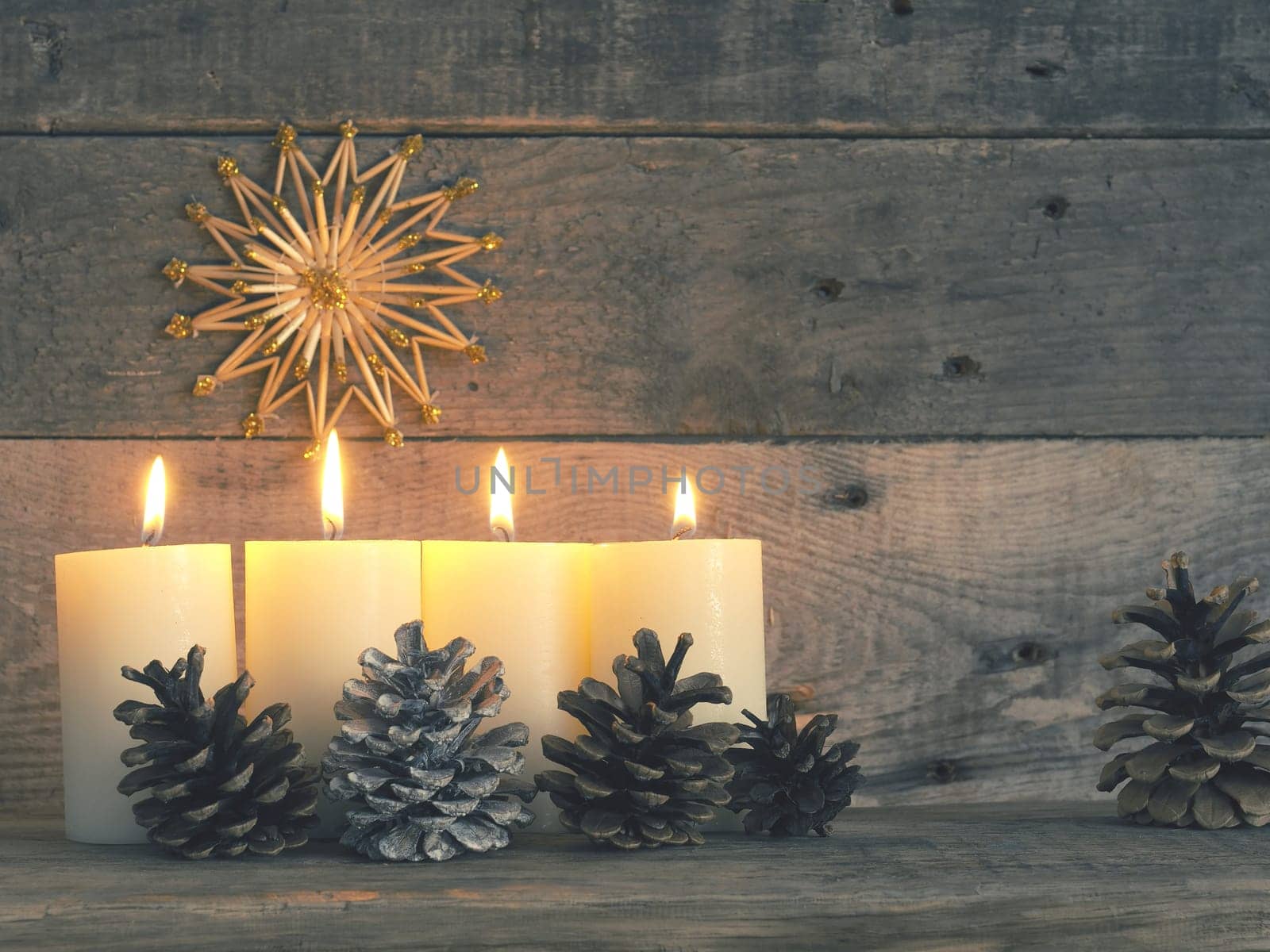 Four Advent candles are burning, fourth Advent candle burns, Christmas concept