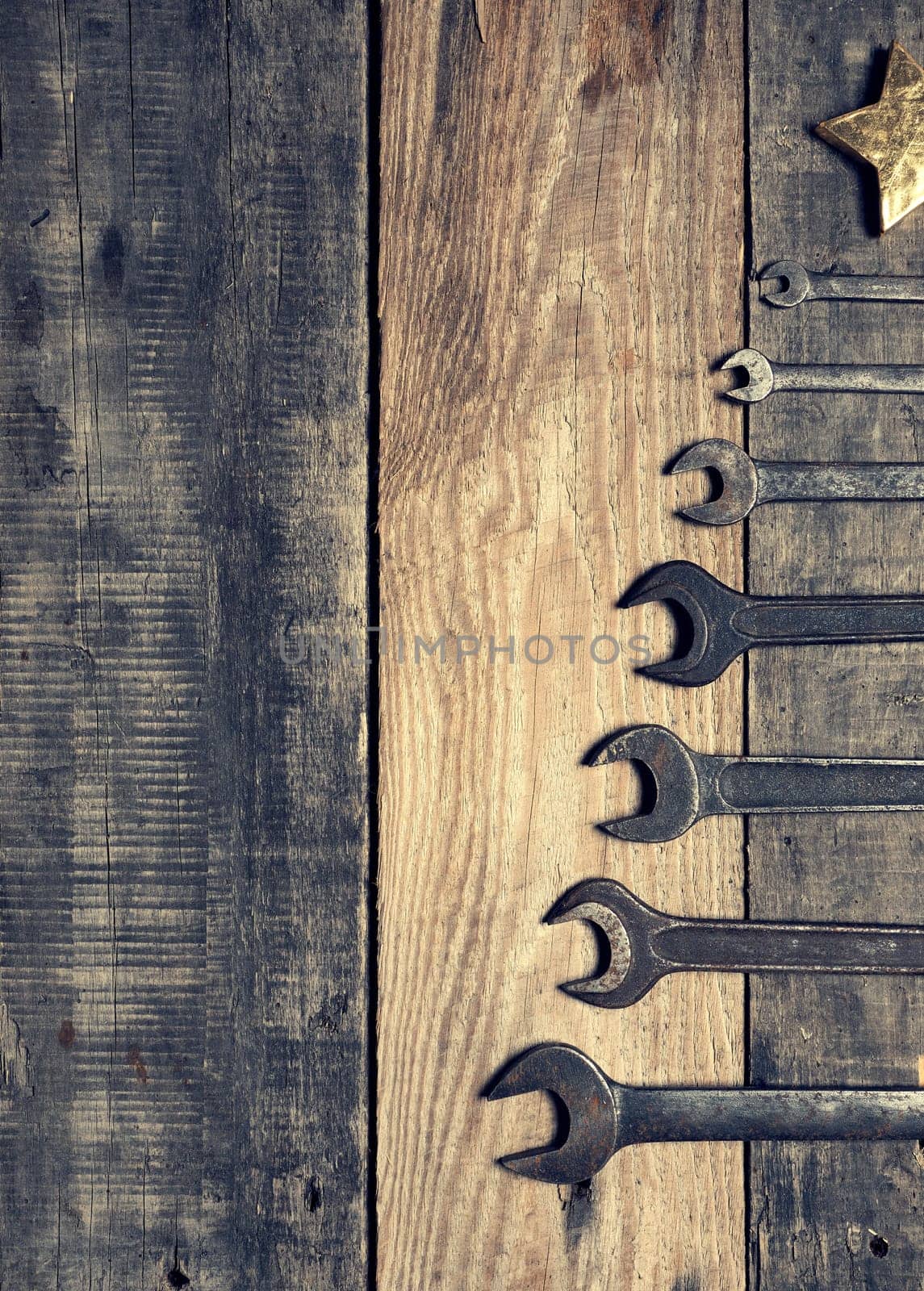 Old used wrenches as a Christmas tree shape with space for text of image, industrial Chrismas concept