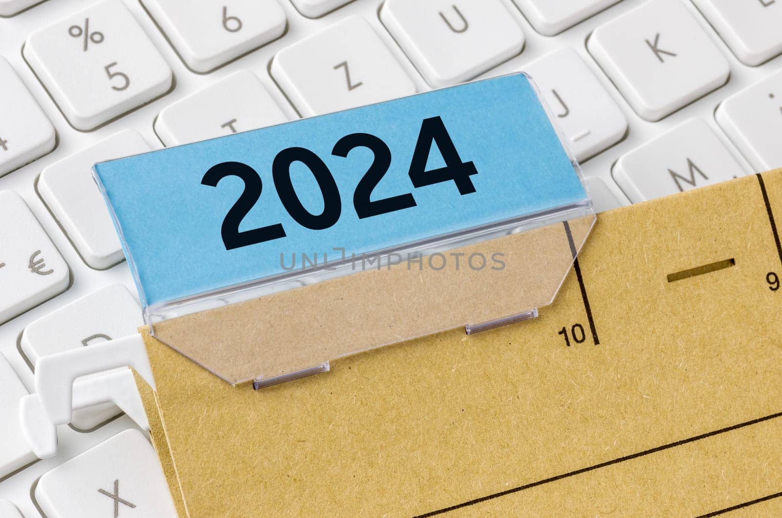 A brown file folder labeled with 2024