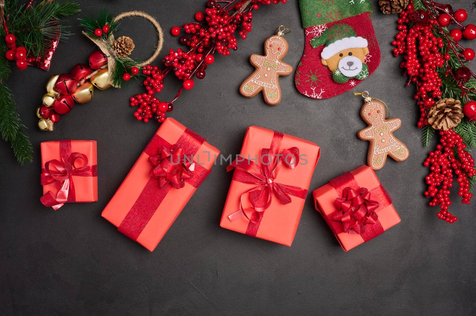 Christmas decor, gift red boxes on a black background, top view. Place for inscription
