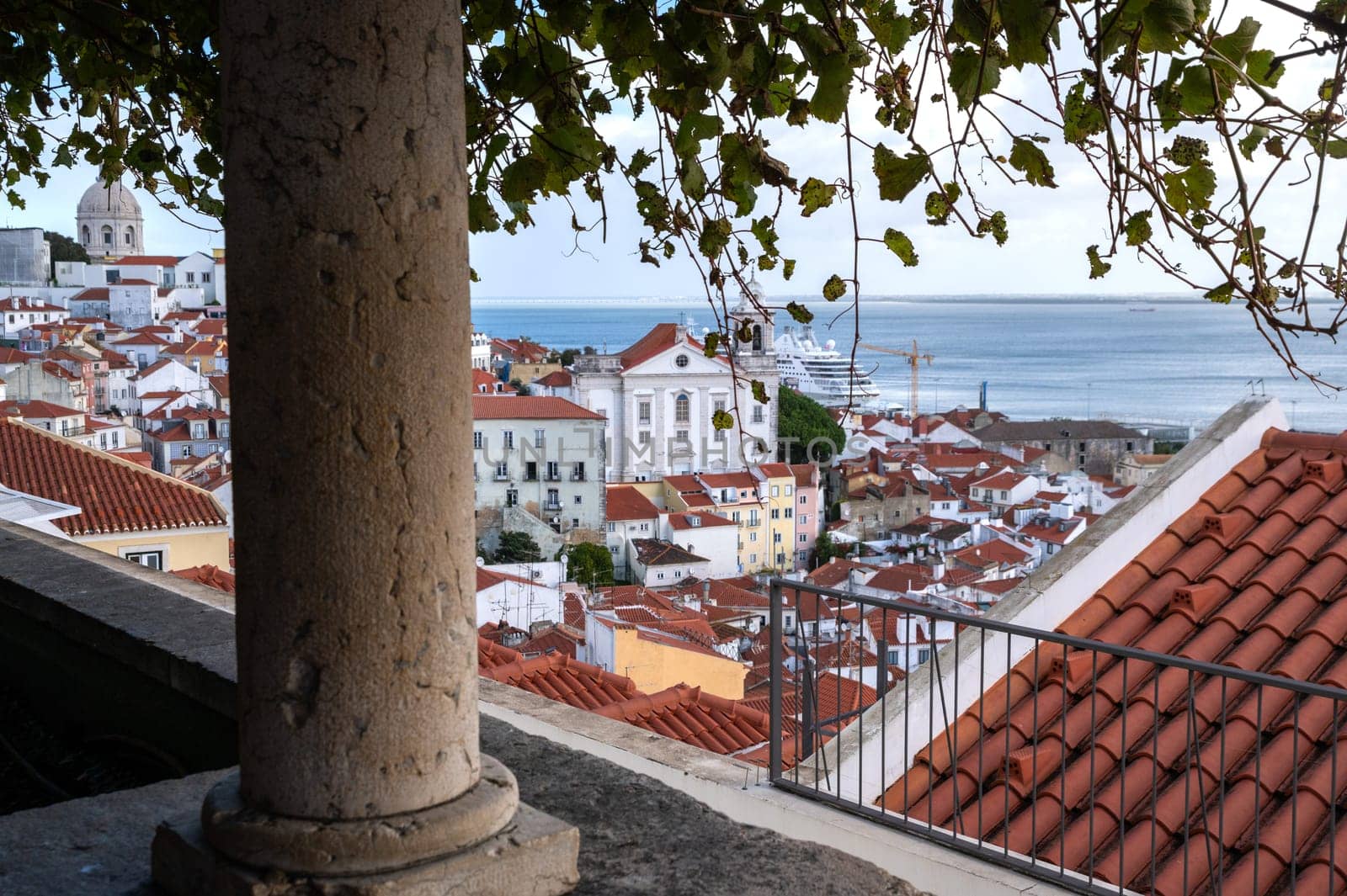 Famous view of Lisbon city with Tage river and Alfama district