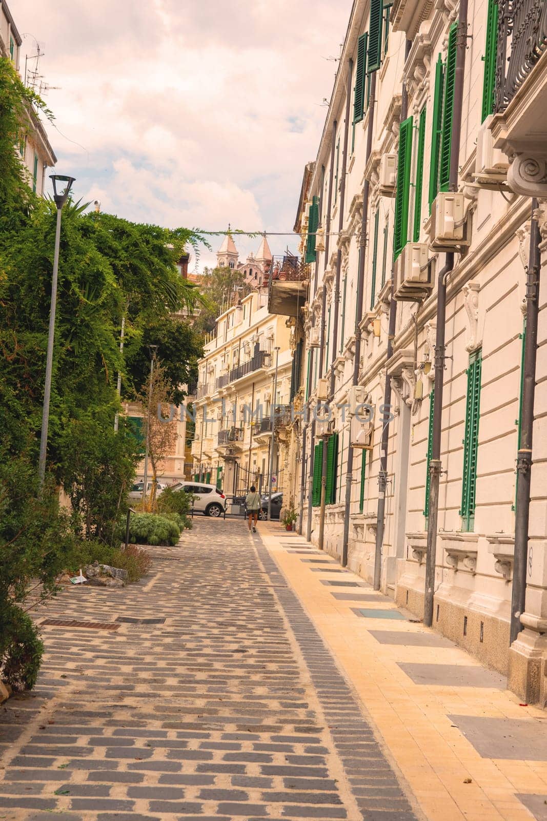 Sicily, Messina, Italy - 26 September 2023 – Street view near centre with famous cathedral in background. City views, facades, architecture and the most popular streets.