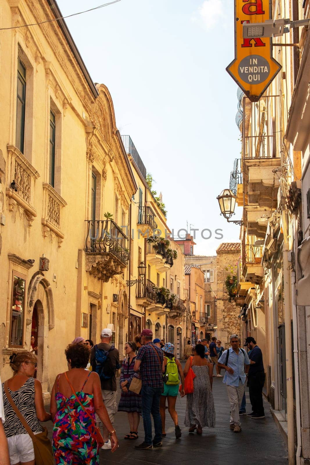 Taormina, Sicily, Italy - 28 September 2023. Tourists in the famous main street Corso umberto in Taormina. City views, facades, architecture and the most popular streets.