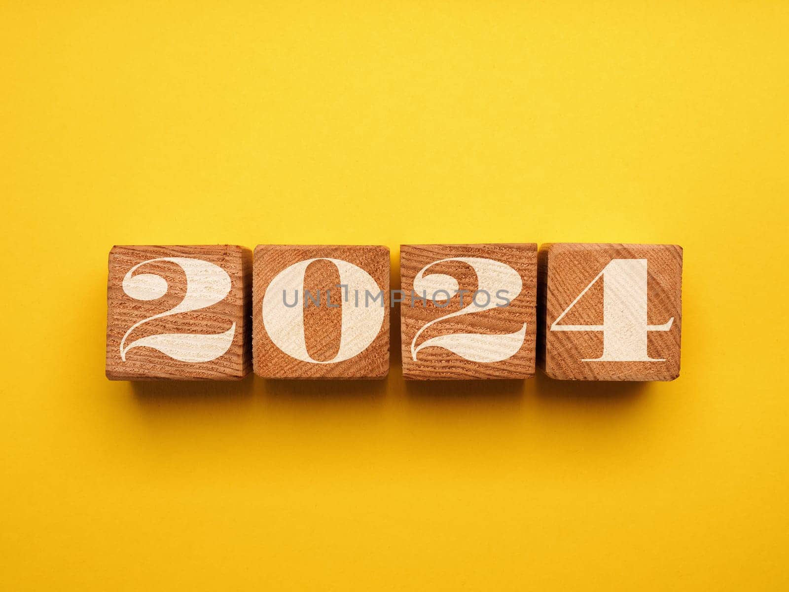 Wooden blocks with the Year number 2024, New Year concept, seasonal Christmas time
