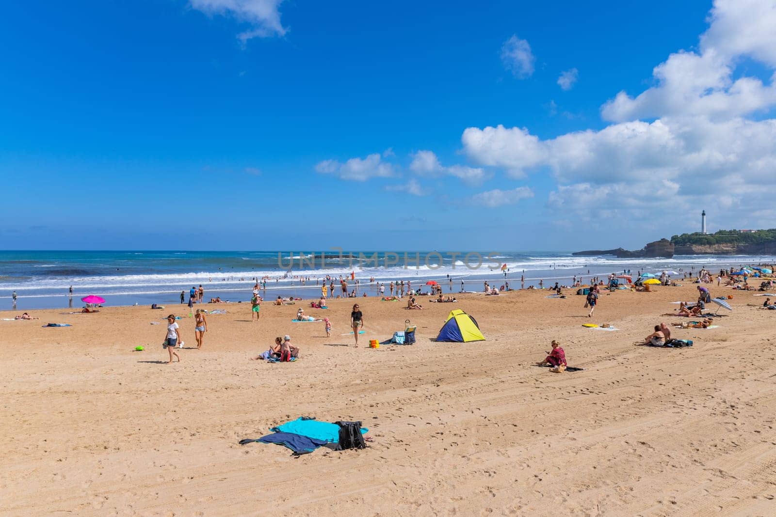 Biarritz, France, July 03, 2023: People at the beach Grande Plage (Big beach) in the French resort town of Biarritz.