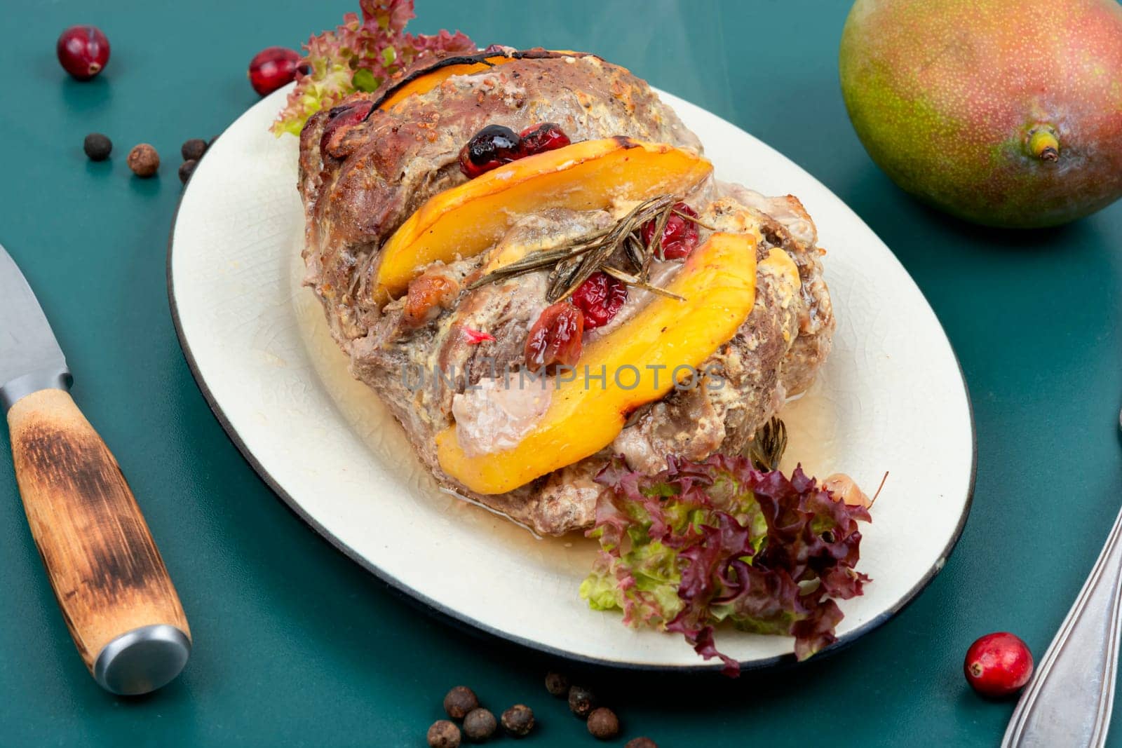 Homemade pork roll baked with aromatic mango pieces.