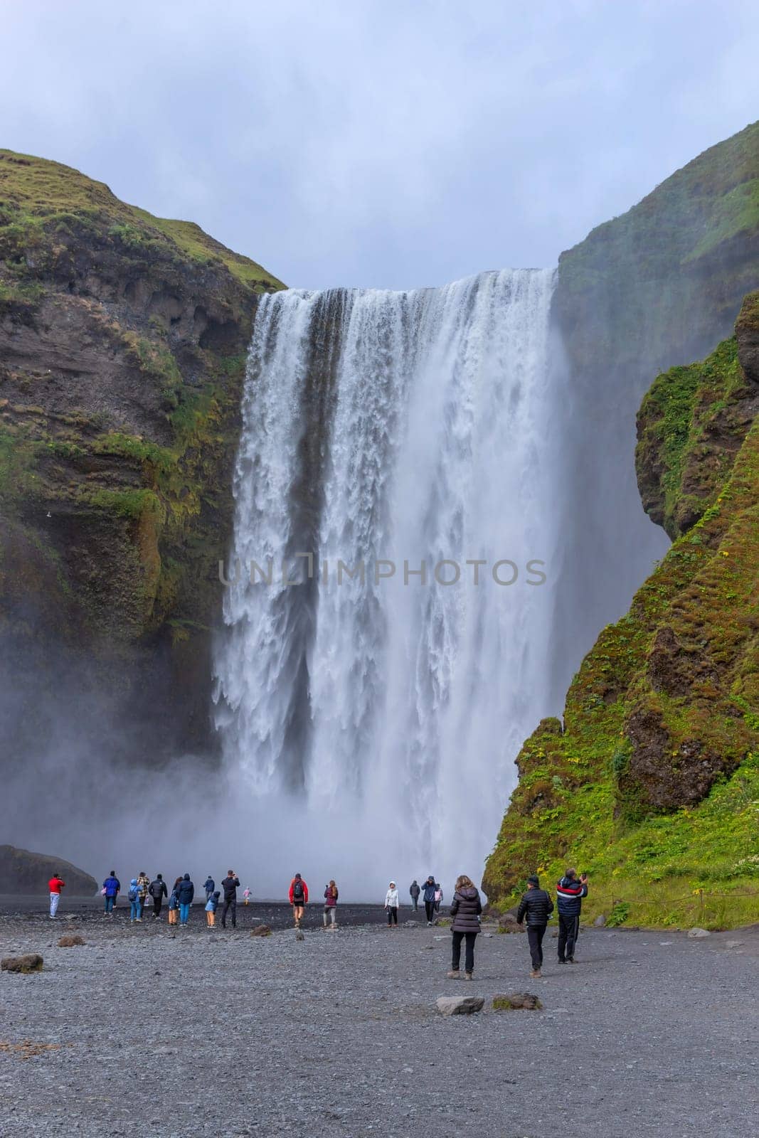 Skogar Iceland - July 28, 2023: Tourists visiting Skogafoss waterfall in south Iceland