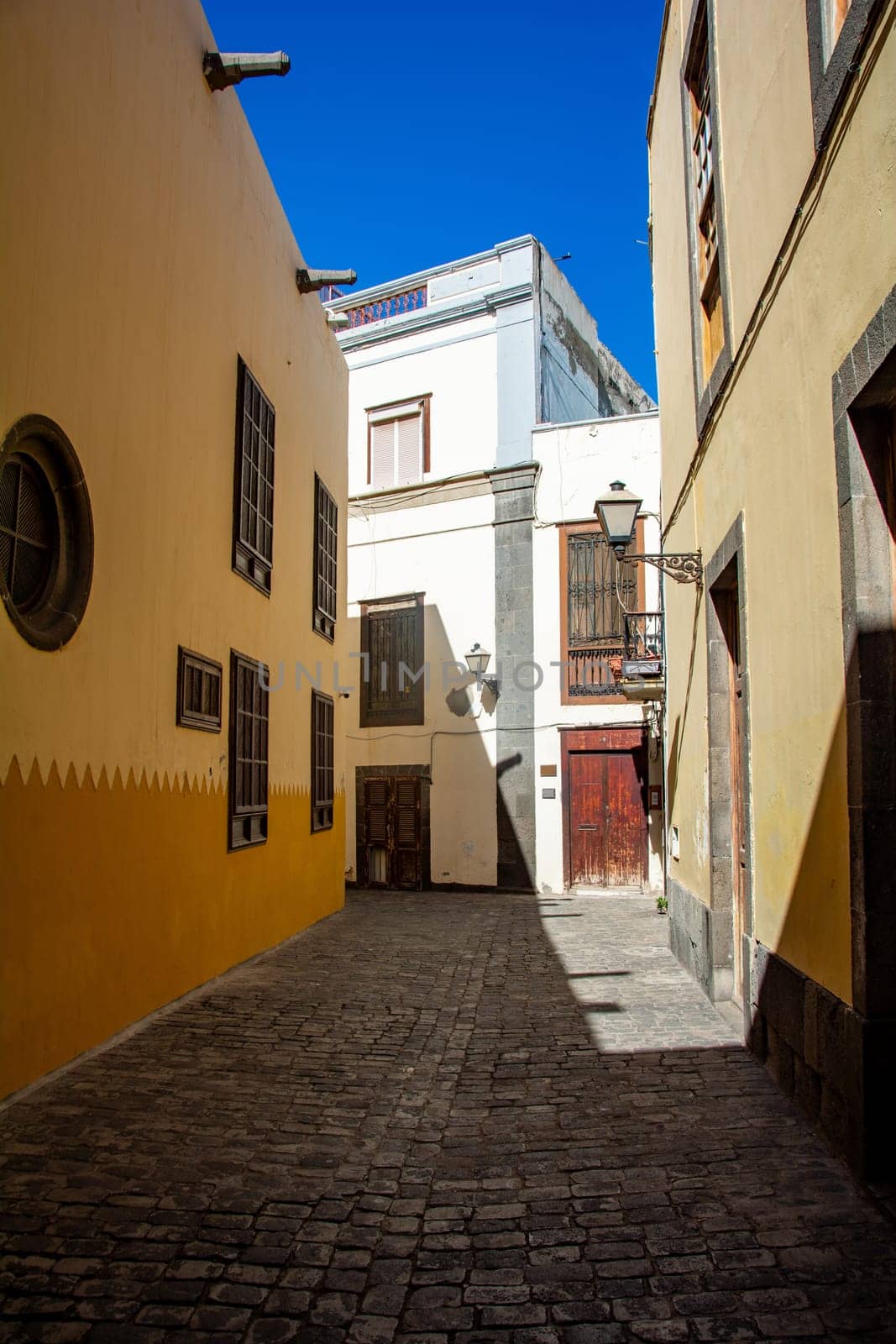 Narrow street with old houses in the historic old town of Las Palmas on the Canary Island of Gran Canaria, Spain, Europe