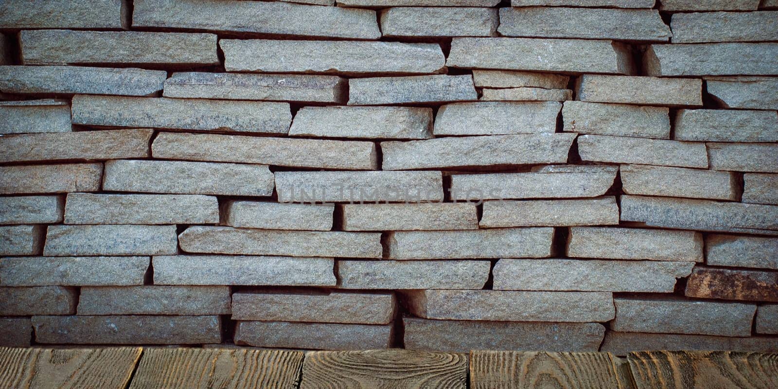 The background is blank wooden boards and a textured brick wall with lighting and vignetting. For product demonstrations, free space, layout, mockup, perspective board, background board.