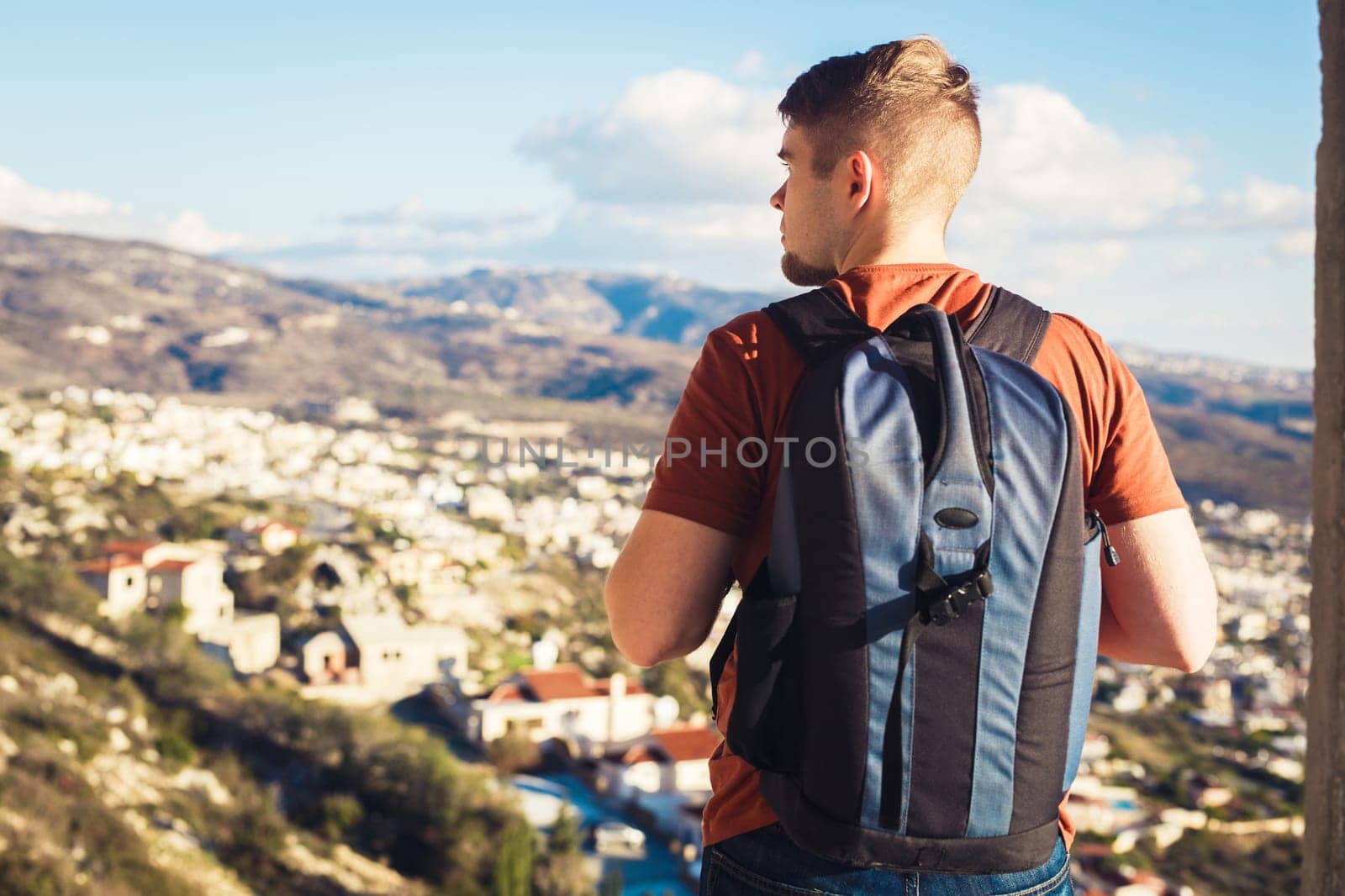 Man traveler with backpack enjoying the natural surroundings.