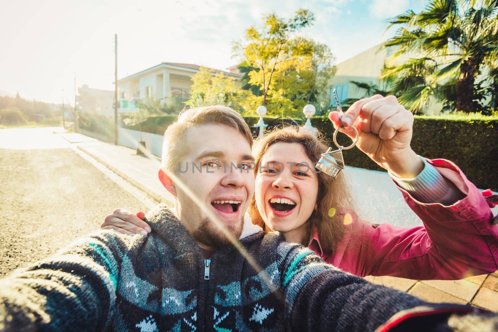 Happy Couple showing their new house keys.