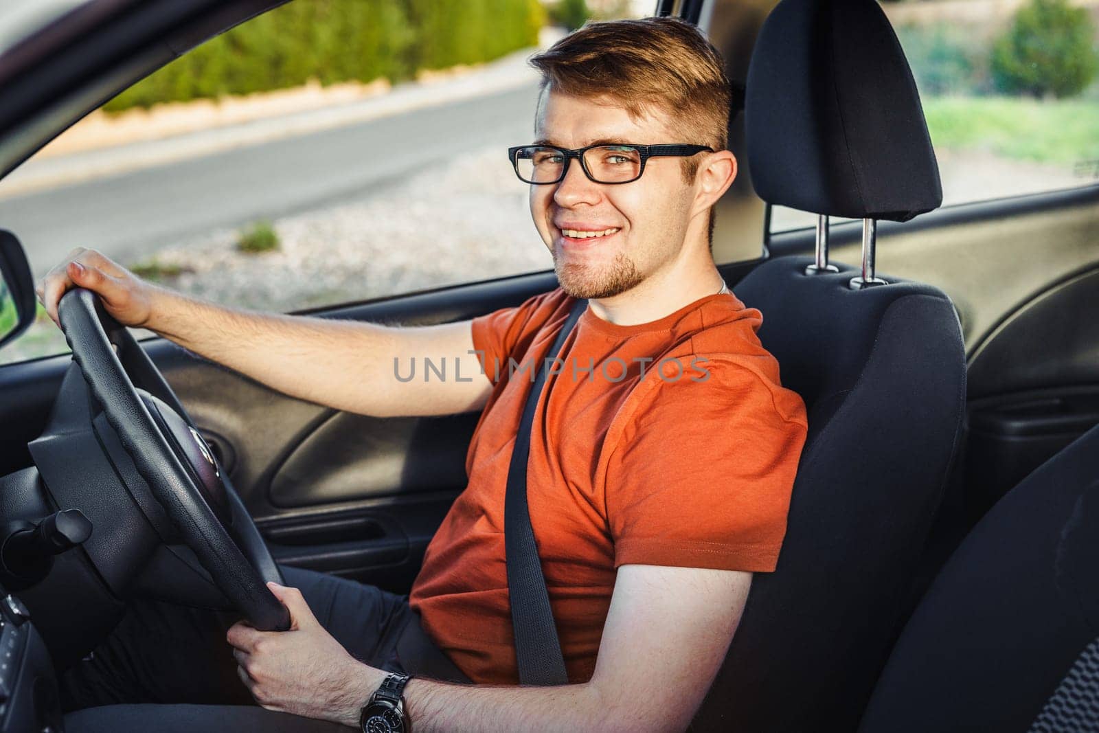 Handsome man in his new car. New car concept
