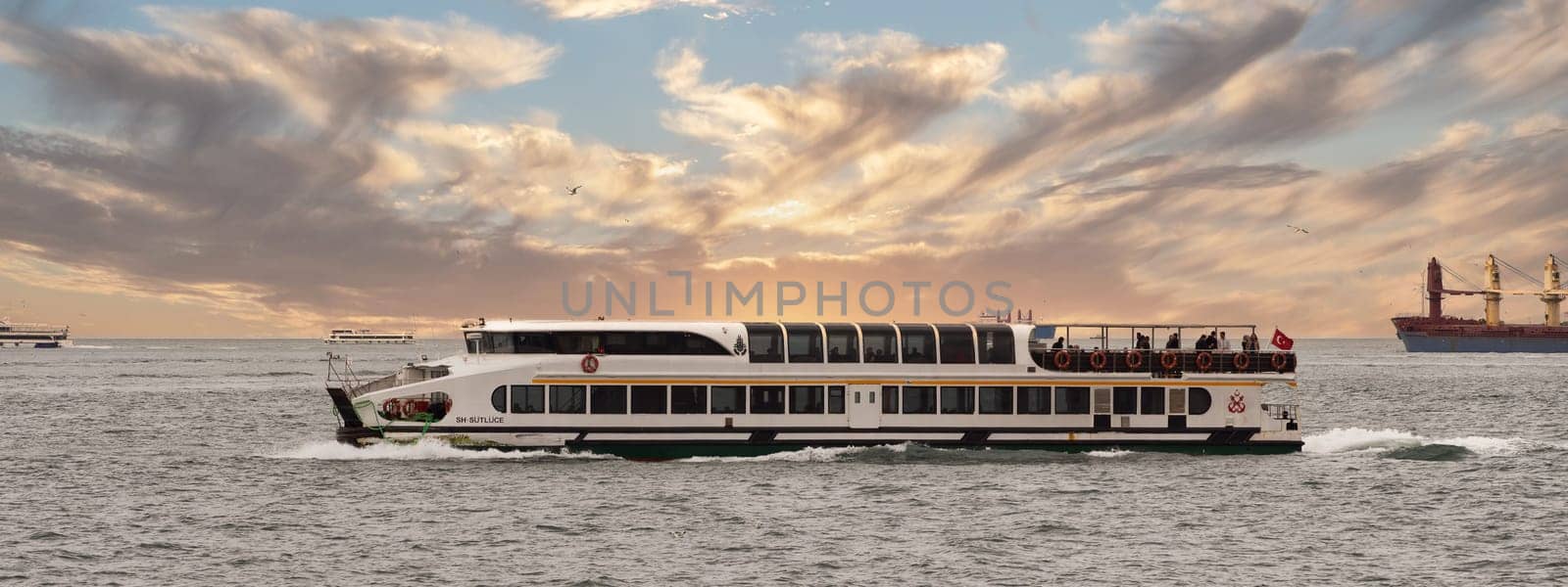 Istanbul, Turkey - May 7, 2023: Modern ferry boat sailing in Bosphorus strait in the early morning
