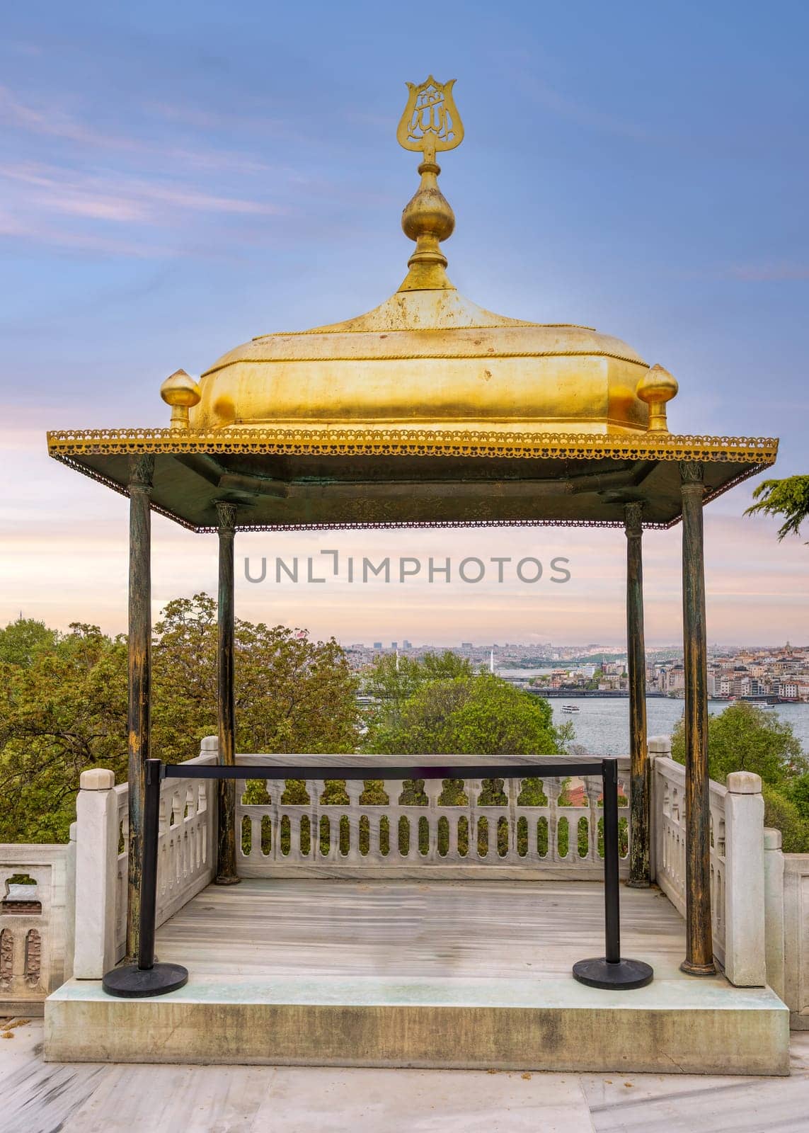 A mesmerizing view of the Iftar Kiosk, aka the Breakfast Kiosk, a golden gazebo adorned with intricate details perched atop Topkapi Palace offering a breathtaking panoramic view of Istanbul, Turkey