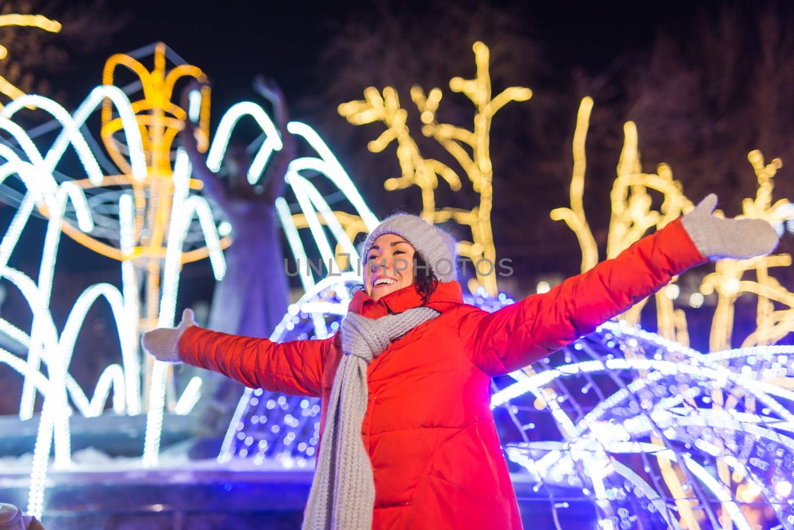 pretty funny girl having fun outdoor in winter. Christmas, city and winter holidays concept.
