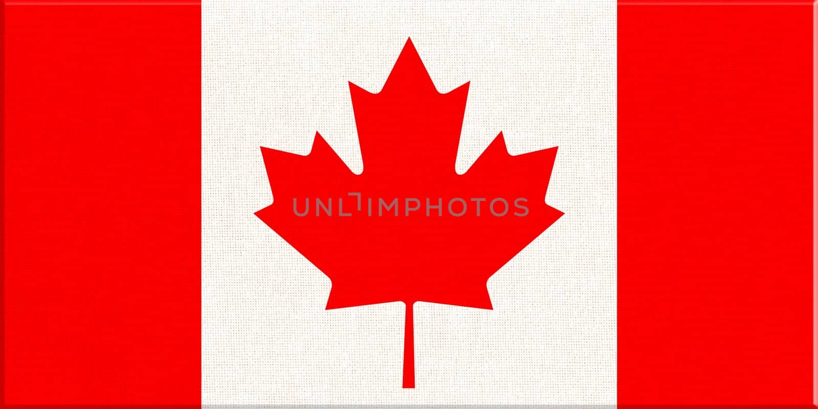 Flag of Canada. Canadian flag on fabric surface with red maple leaf on white background. Canadian national flag on textured background. Fabric Texture. American country