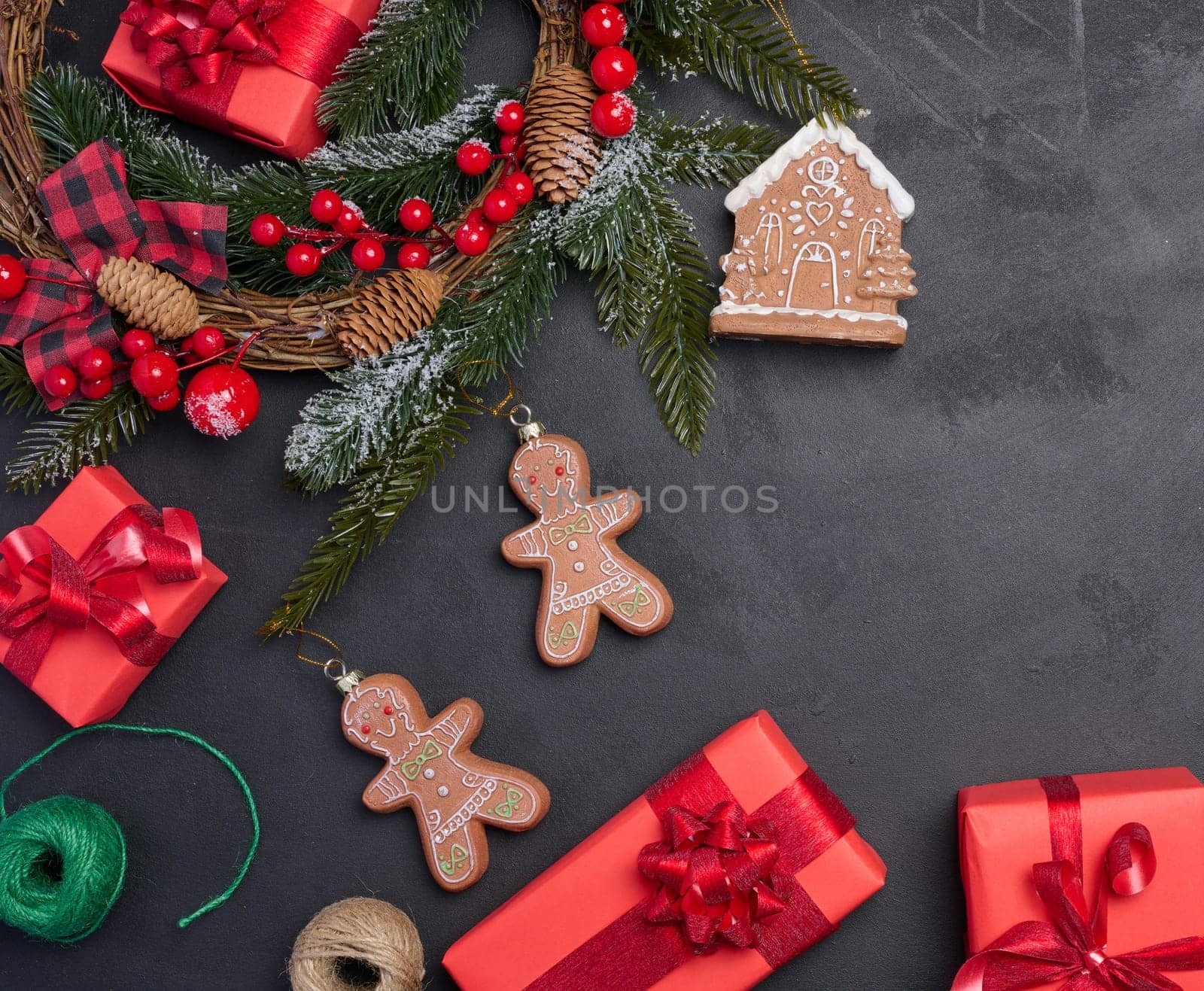 Christmas decor, gift red boxes on a black background, top view.